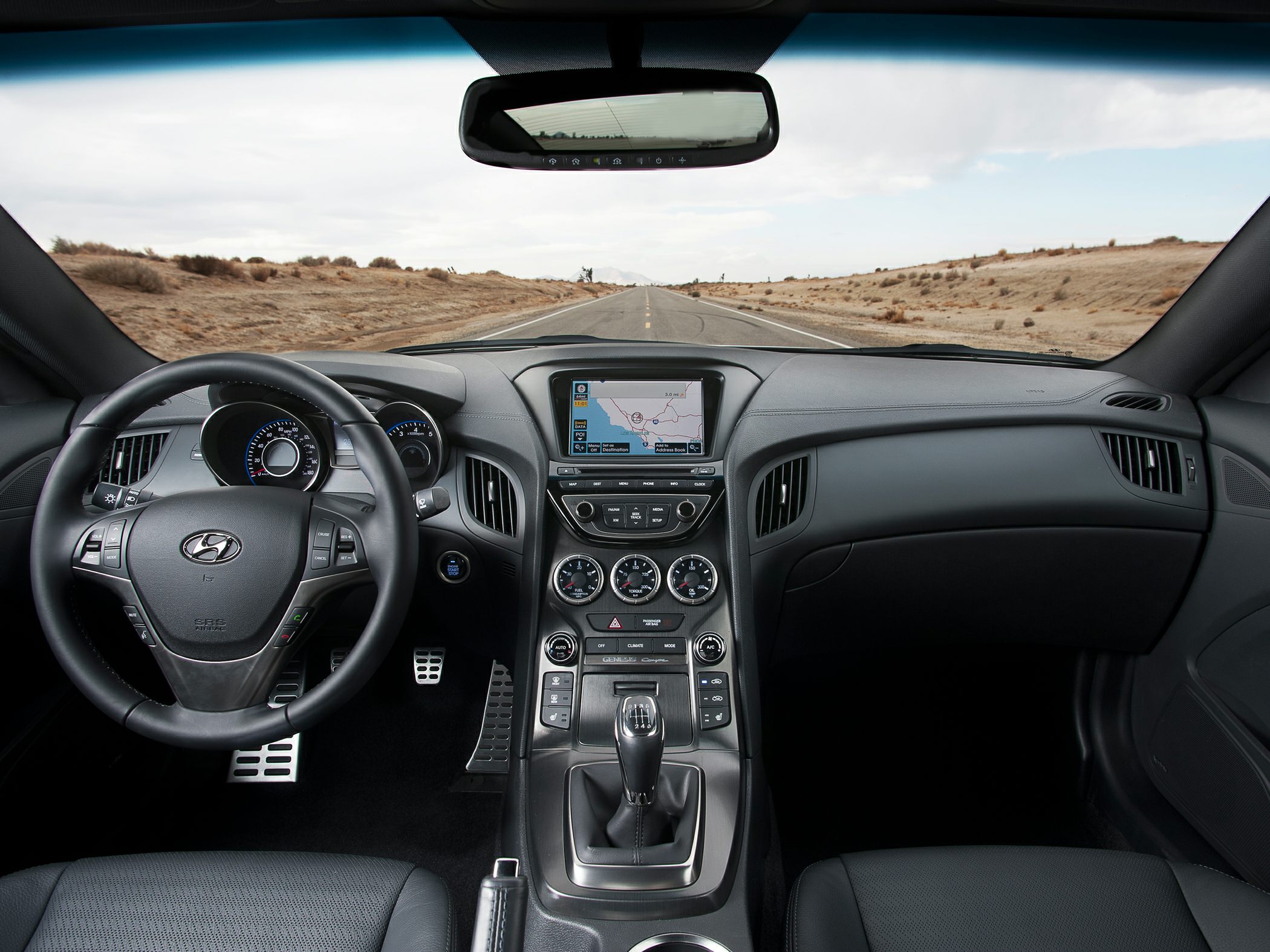 Dashboard and manual gear shift interior of a 2012 sports coupe
