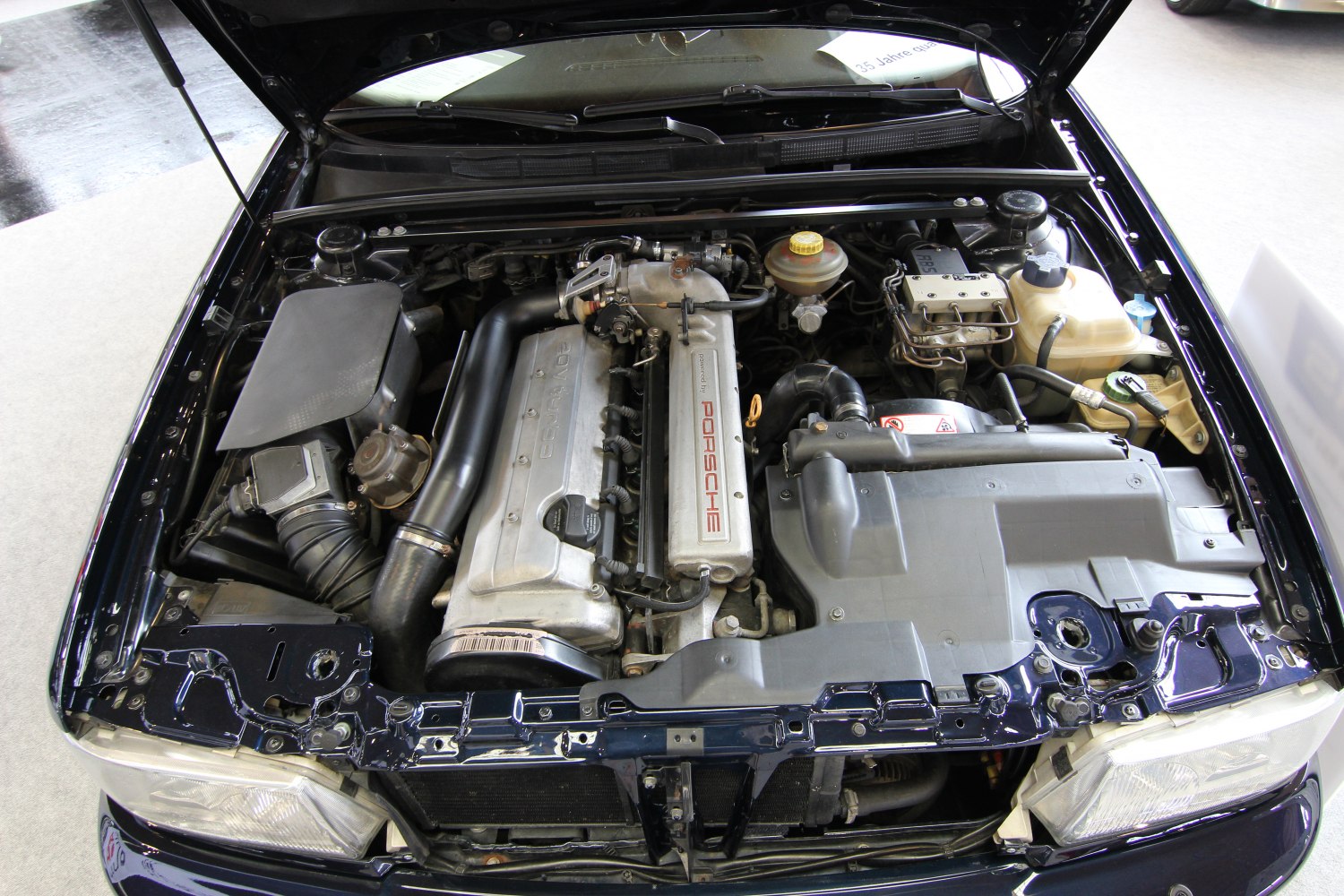 Porsche 20-valve turbocharged engine bay with detailed under-hood layout