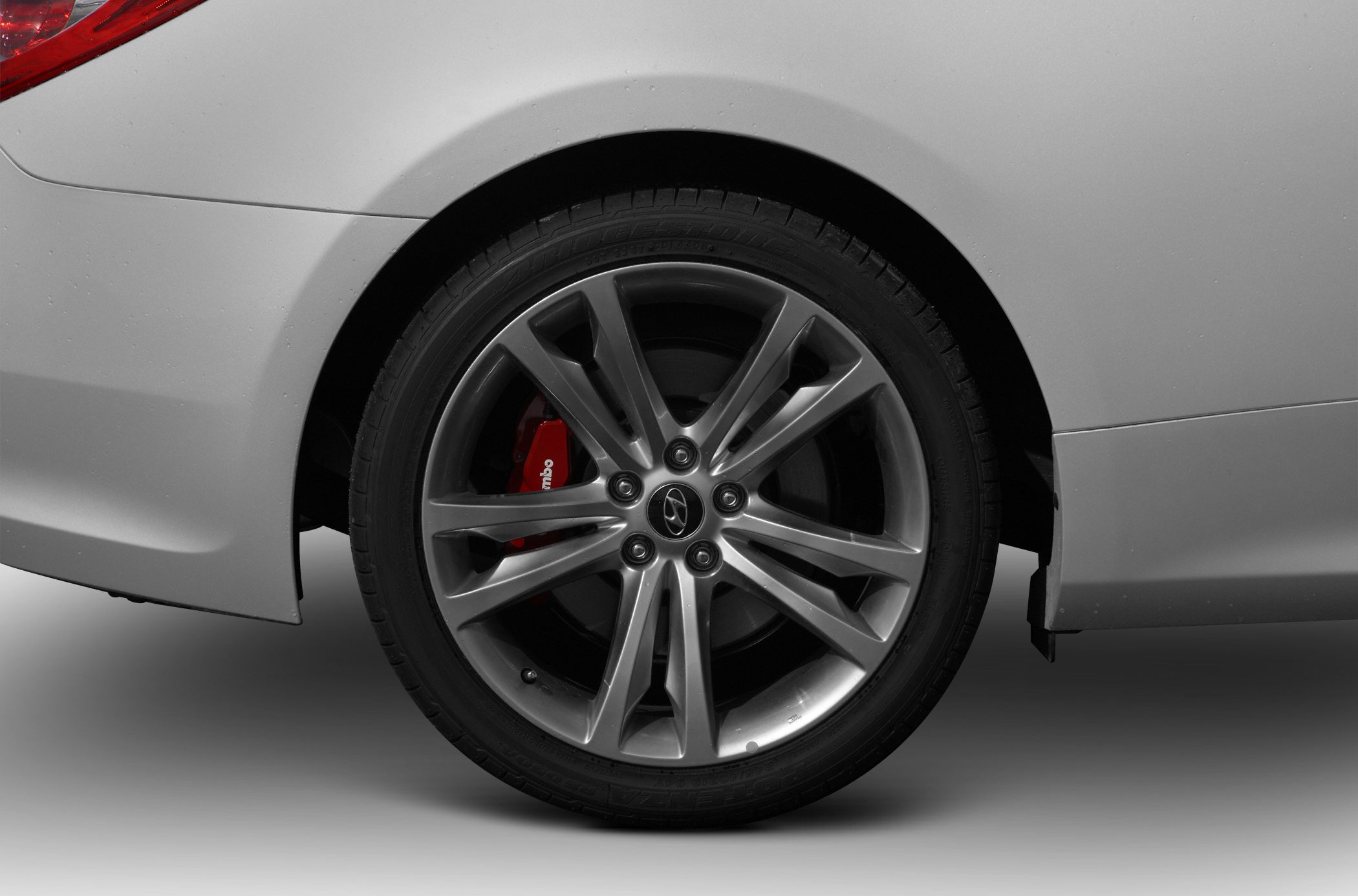 Multi-spoke alloy wheel with red Brembo brake caliper
