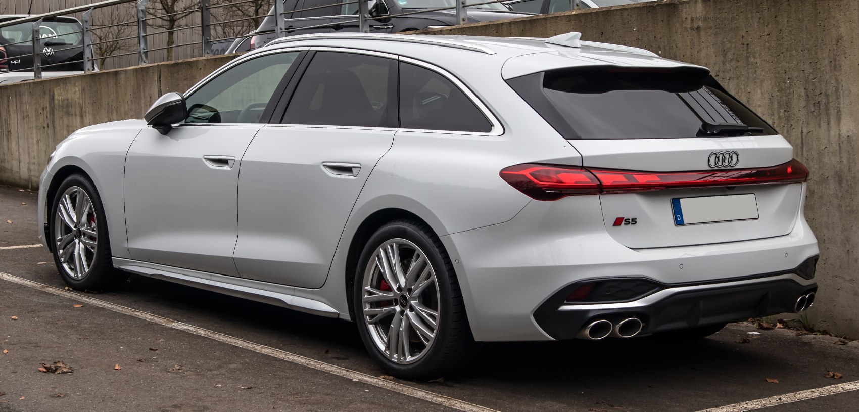 White sport station wagon with quad exhaust, sleek rear and side view