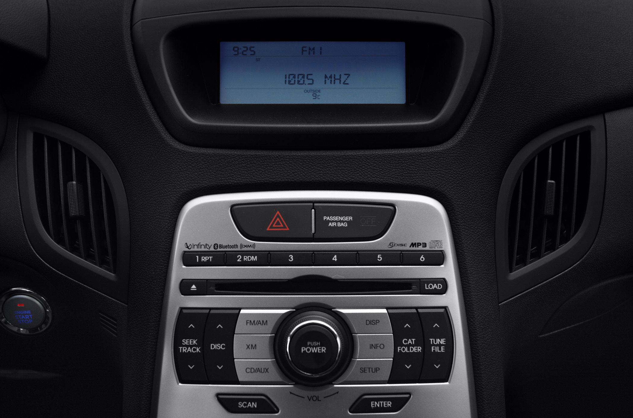 Center console with infotainment system and control buttons