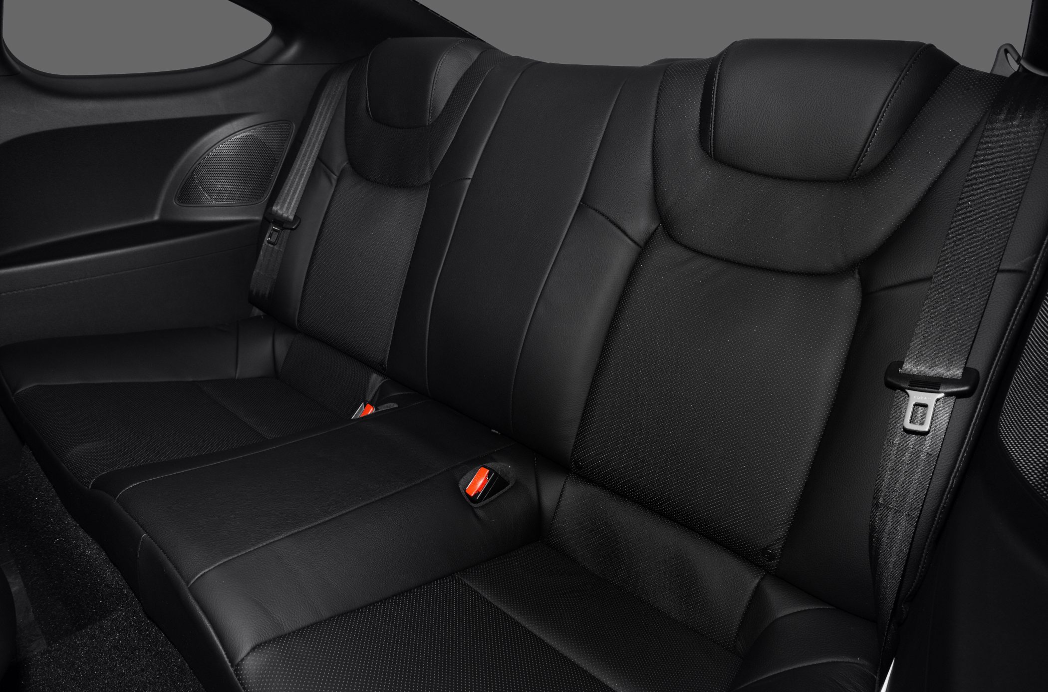 Black leather rear seat with seat belts and speaker panel