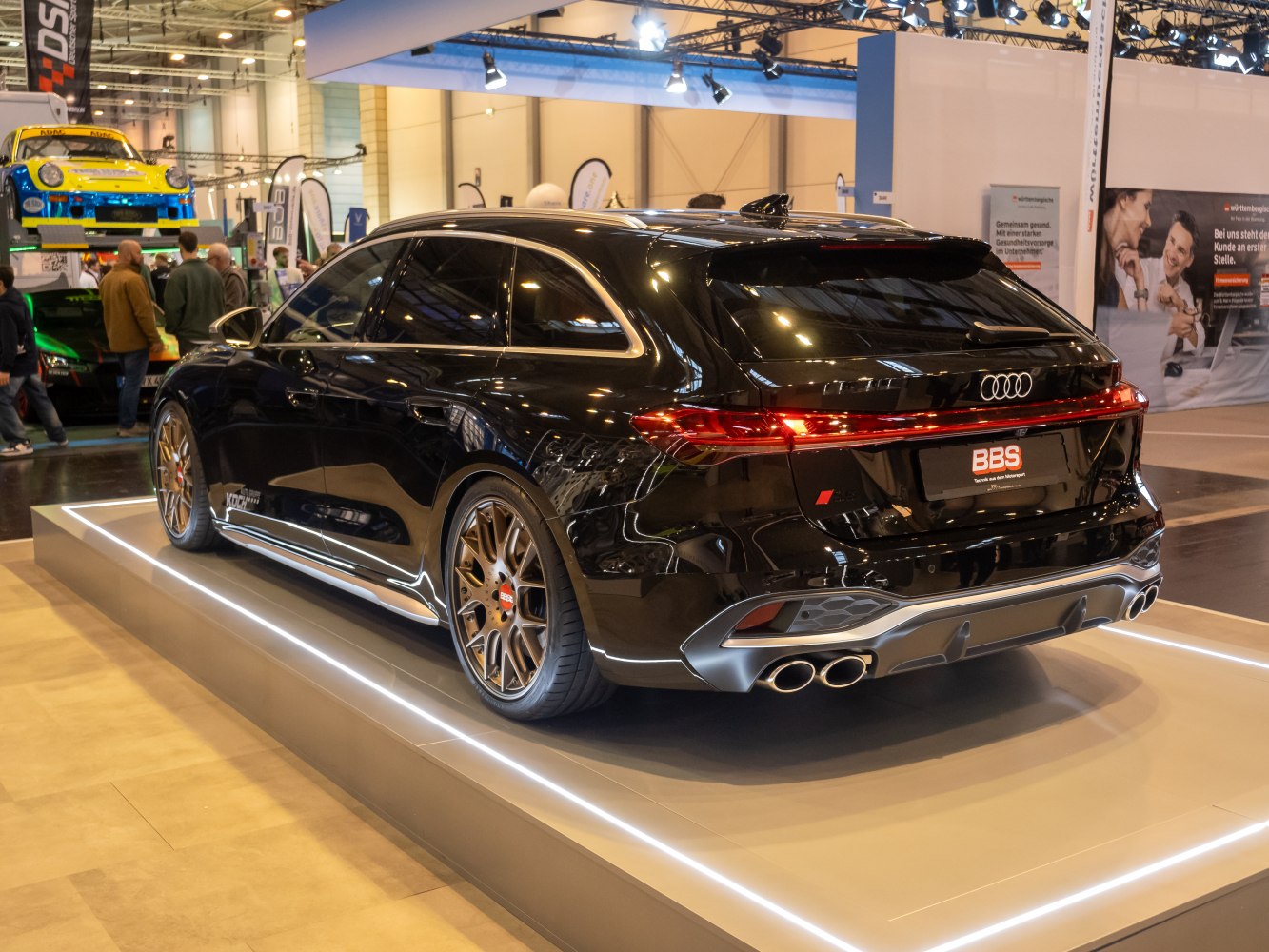 Rear view with quad exhaust and gold alloy wheels