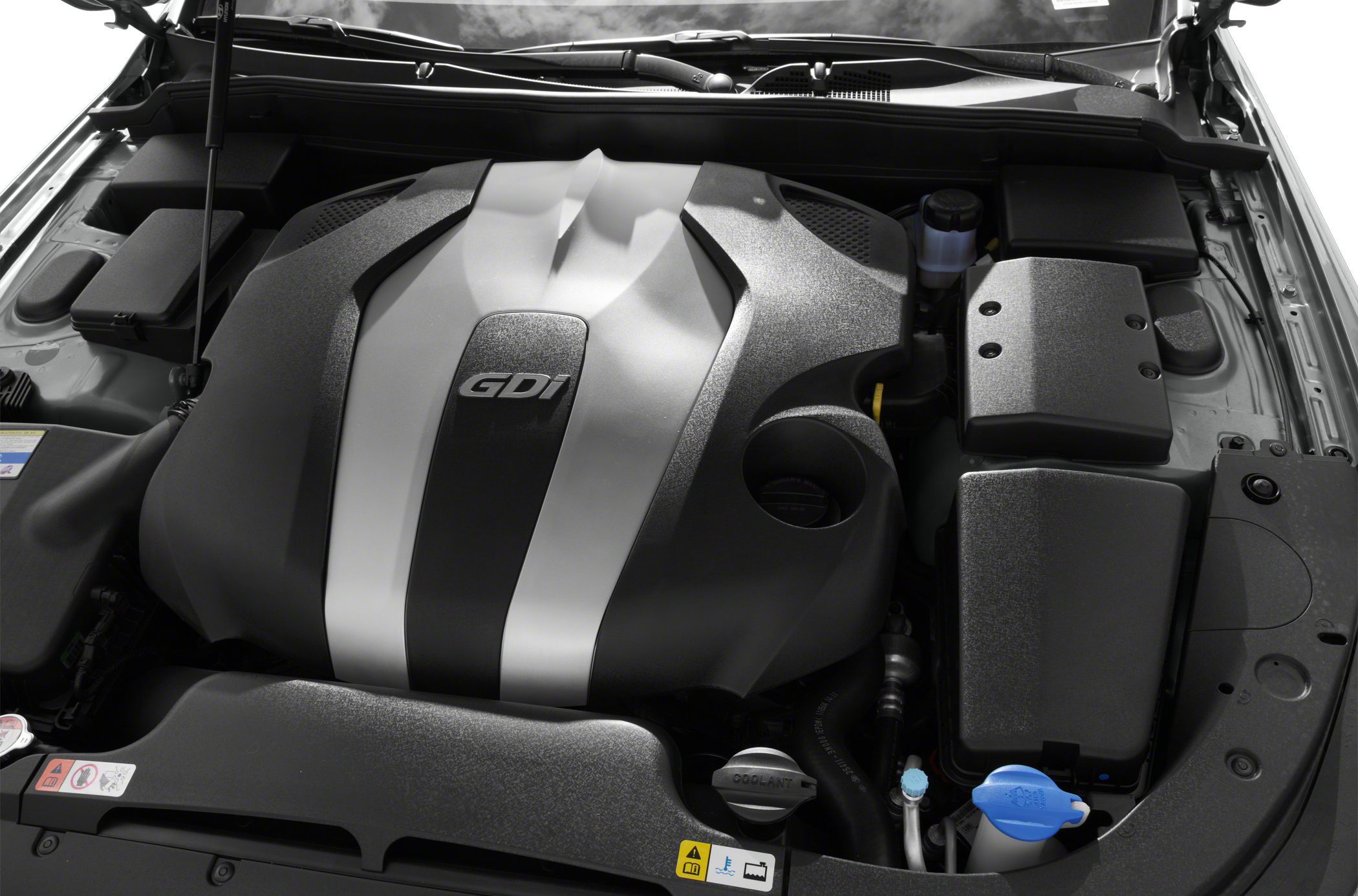 Close-up of a GDI engine under a car hood.