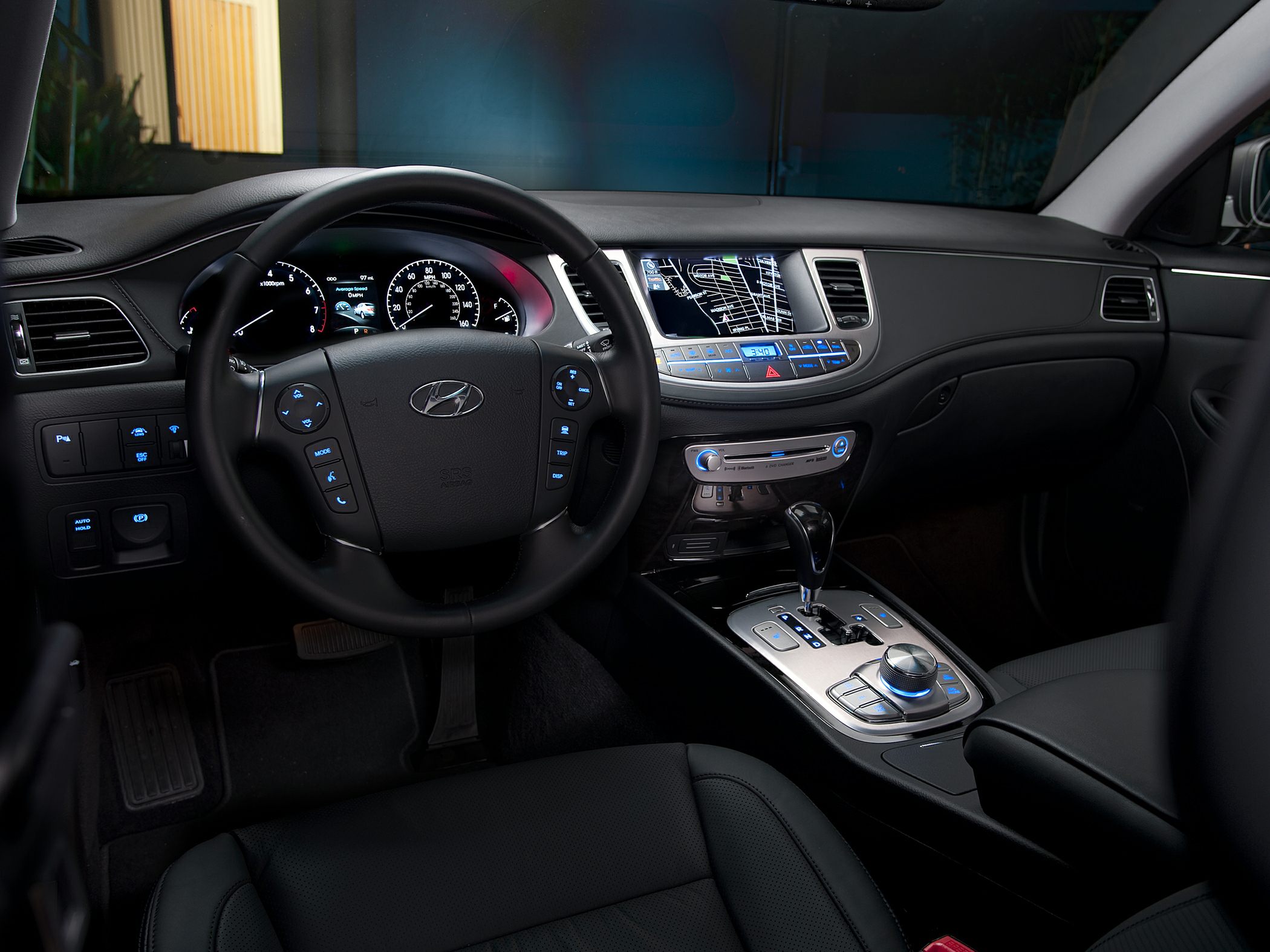 Interior dashboard and steering wheel with controls and navigation screen