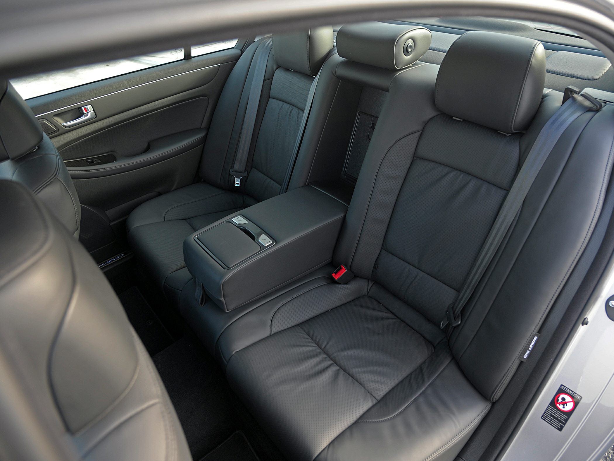 Luxury rear seats with black leather upholstery and center armrest