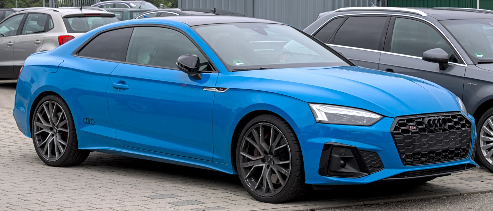 Sporty coupe with aggressive hexagonal grille and LED headlights