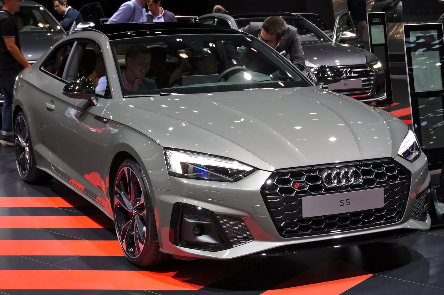 Front view with LED headlights and honeycomb grille.
