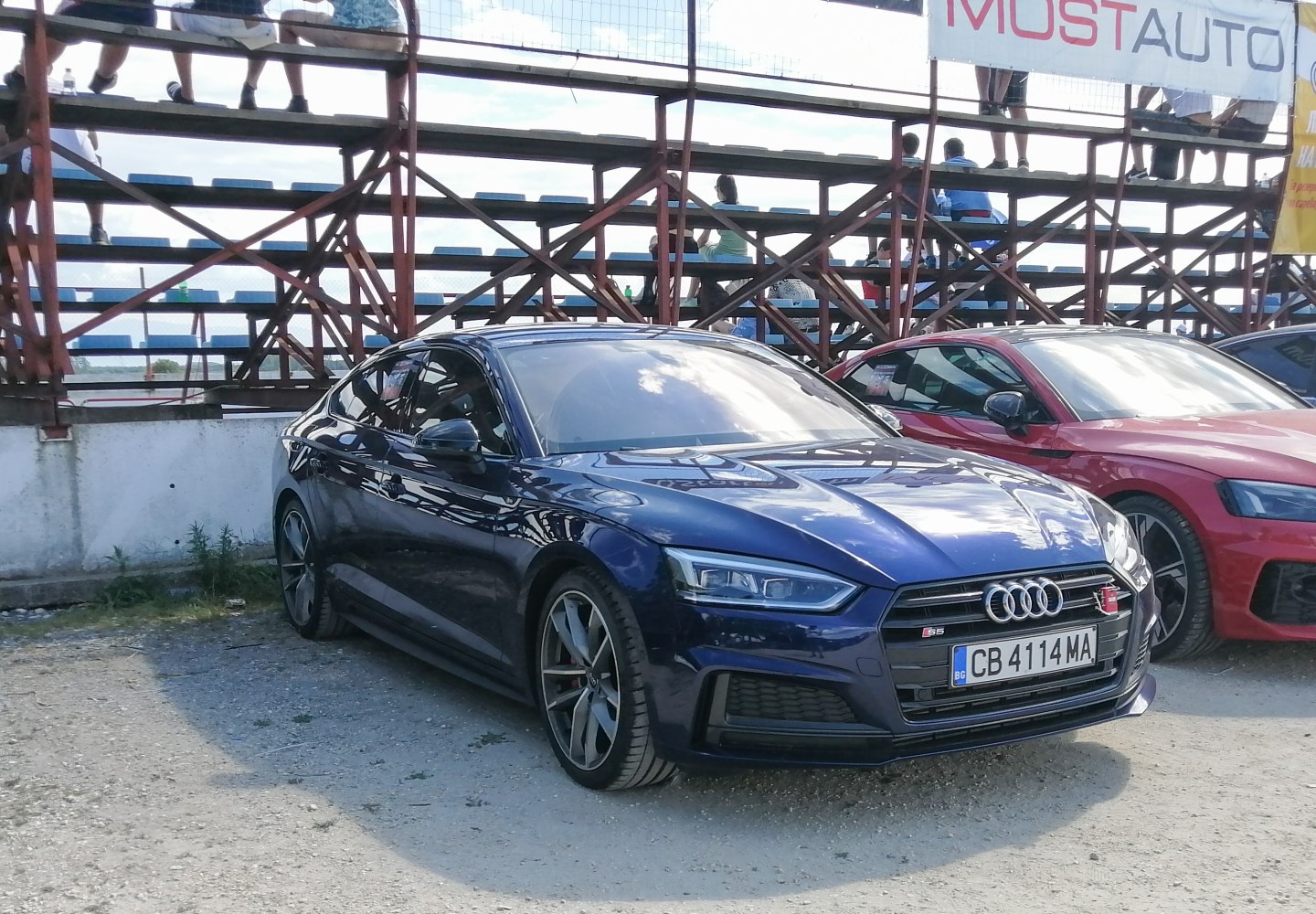 Front and side view of a sleek blue sportback with LED headlights