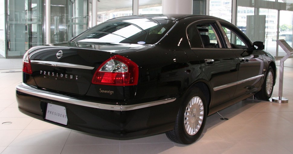 Luxury sedan rear view with chrome trim and distinct taillights