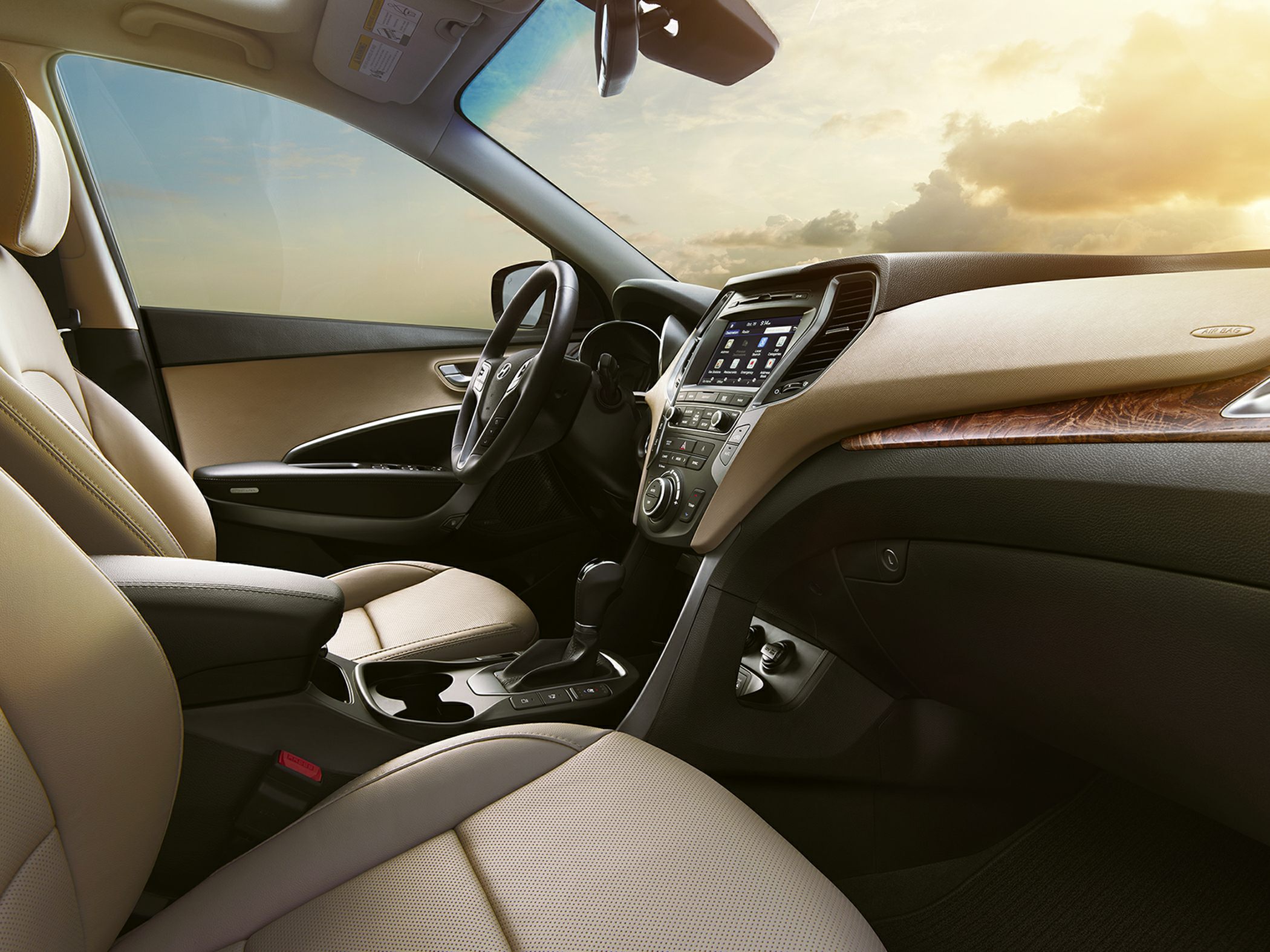 Beige leather seats and advanced infotainment system in car interior