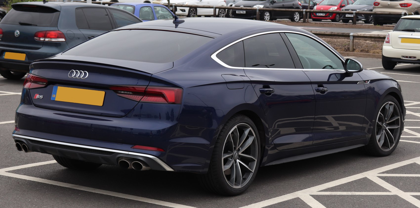 Sleek rear view with quad exhaust and LED taillights