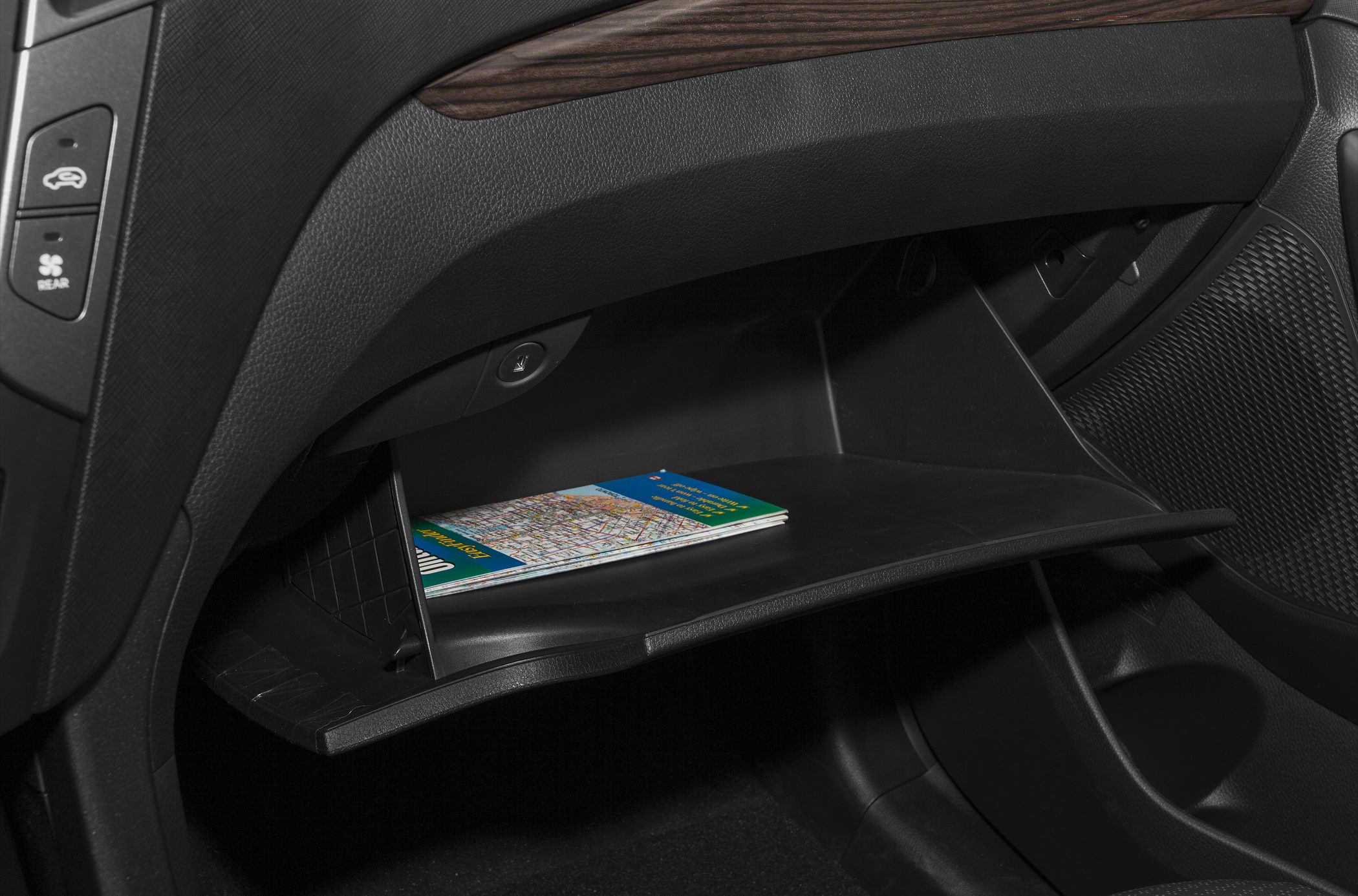 Open glove compartment with a map inside