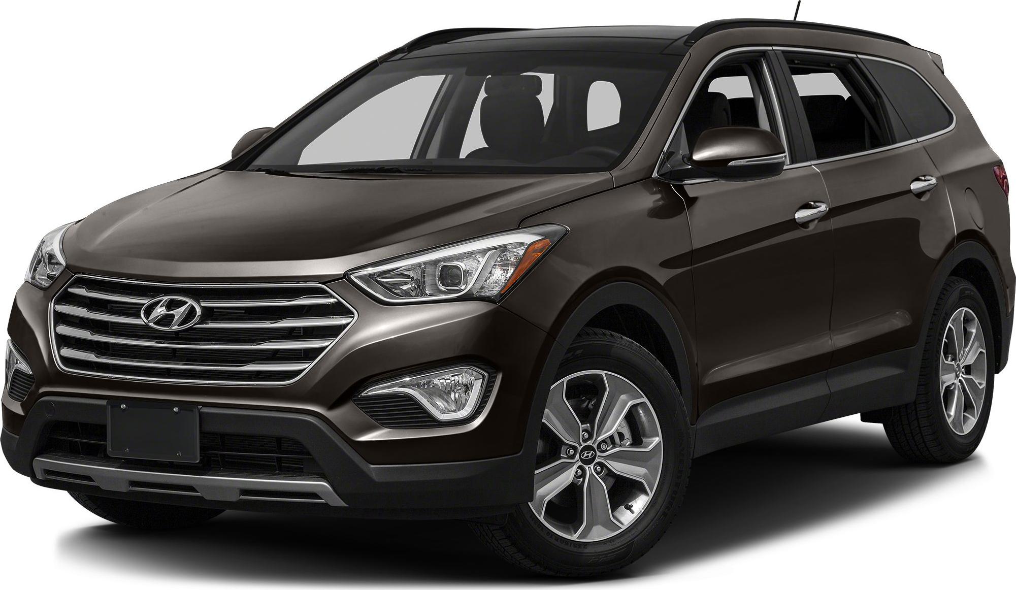 Front-side view featuring grille, headlights, and alloy wheels