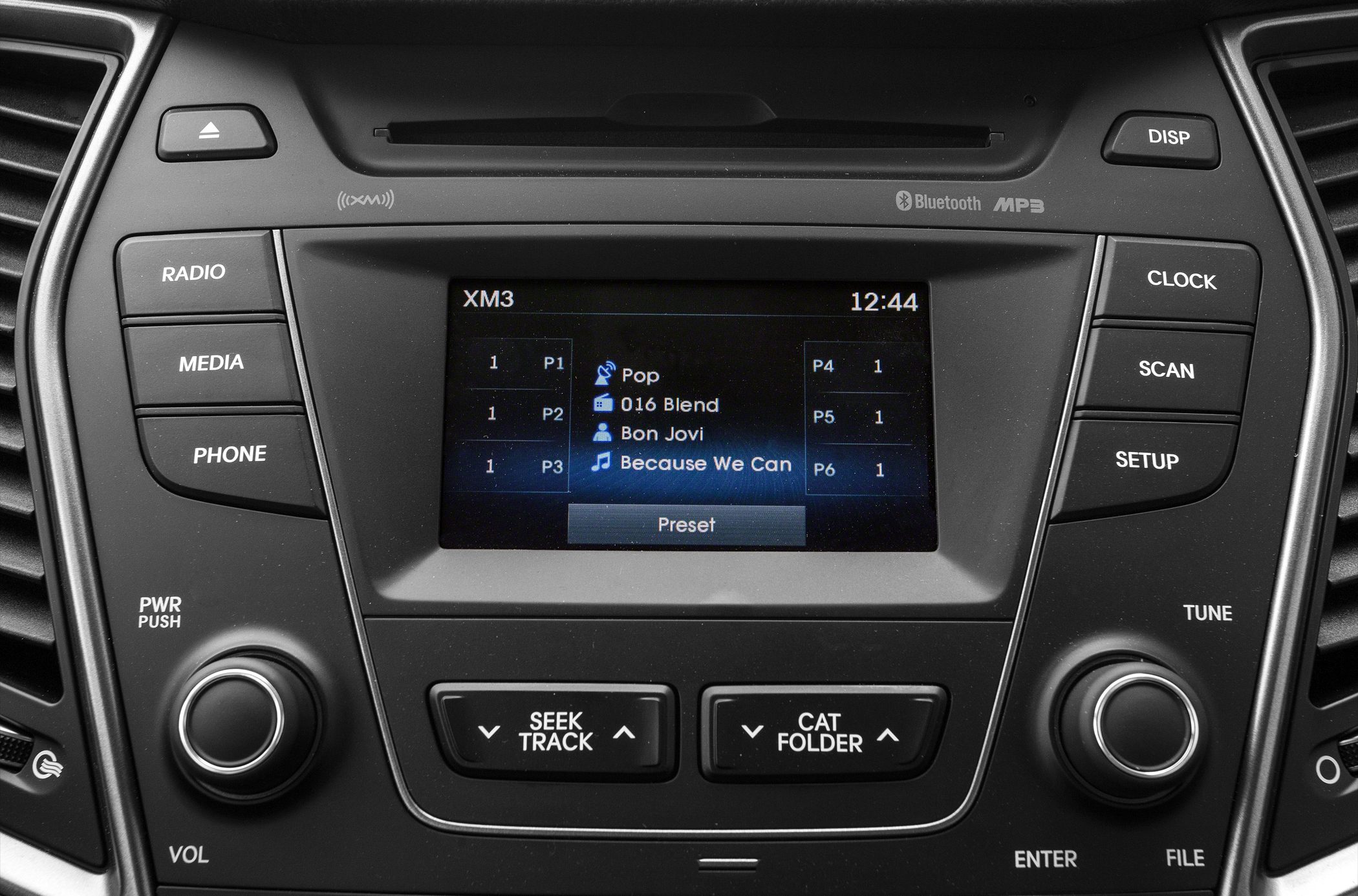Car audio system display with radio, Bluetooth, and media control buttons