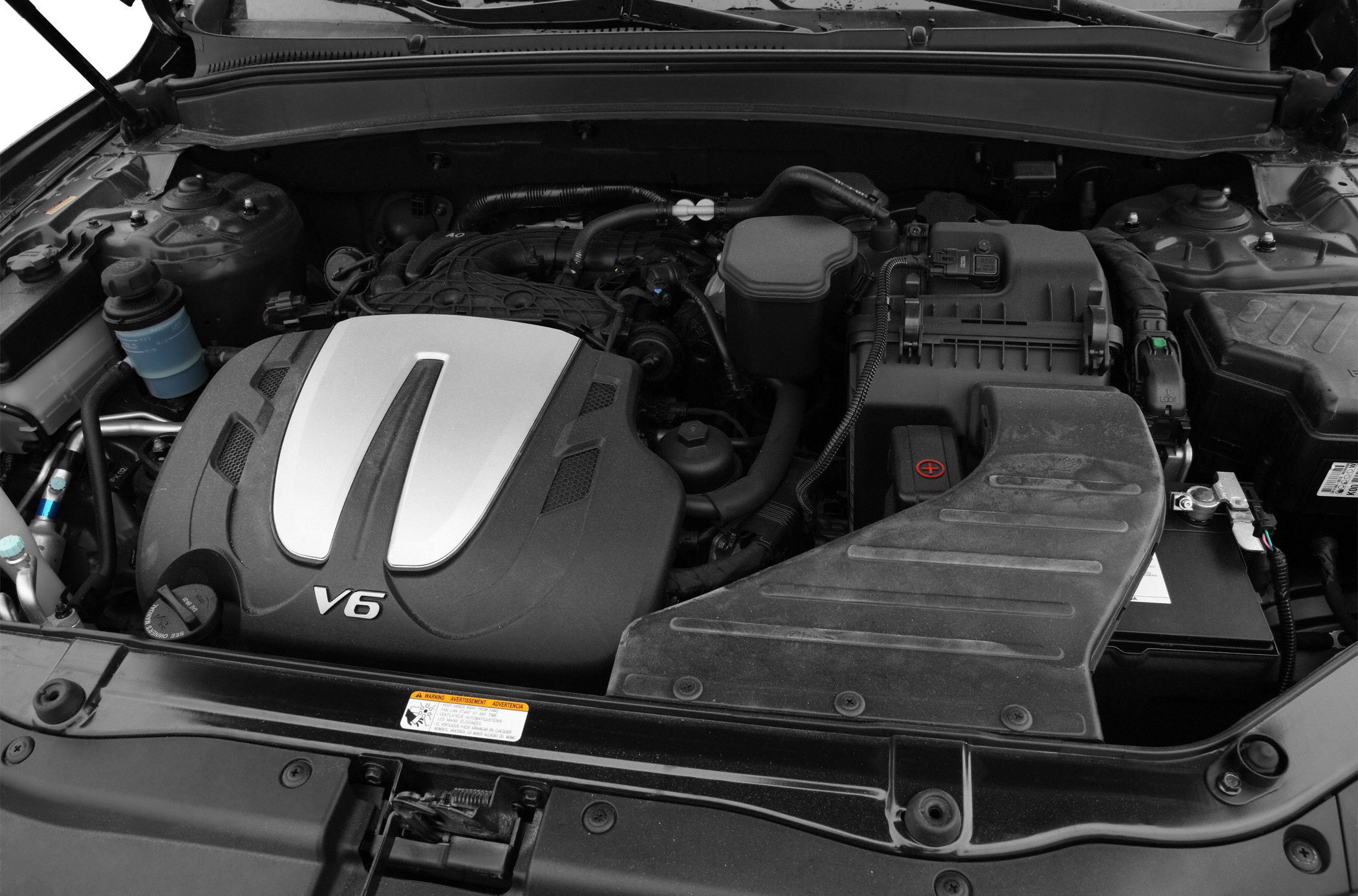 V6 engine bay with visible engine cover and components