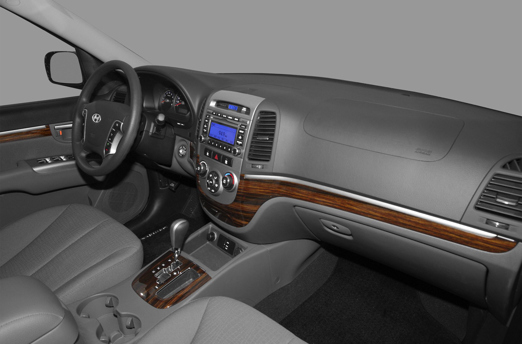 Dashboard and center console with wooden trim and multimedia controls