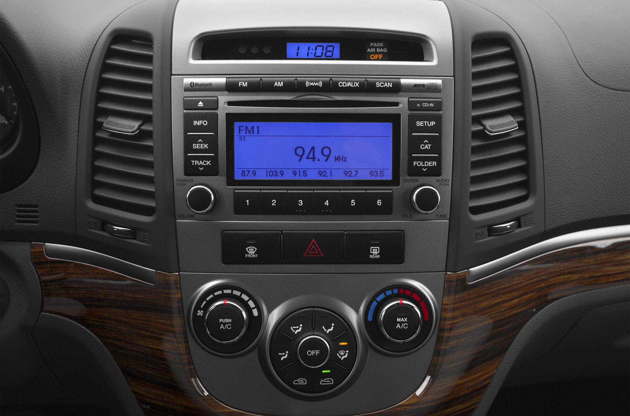 Car interior console with radio and climate control dials