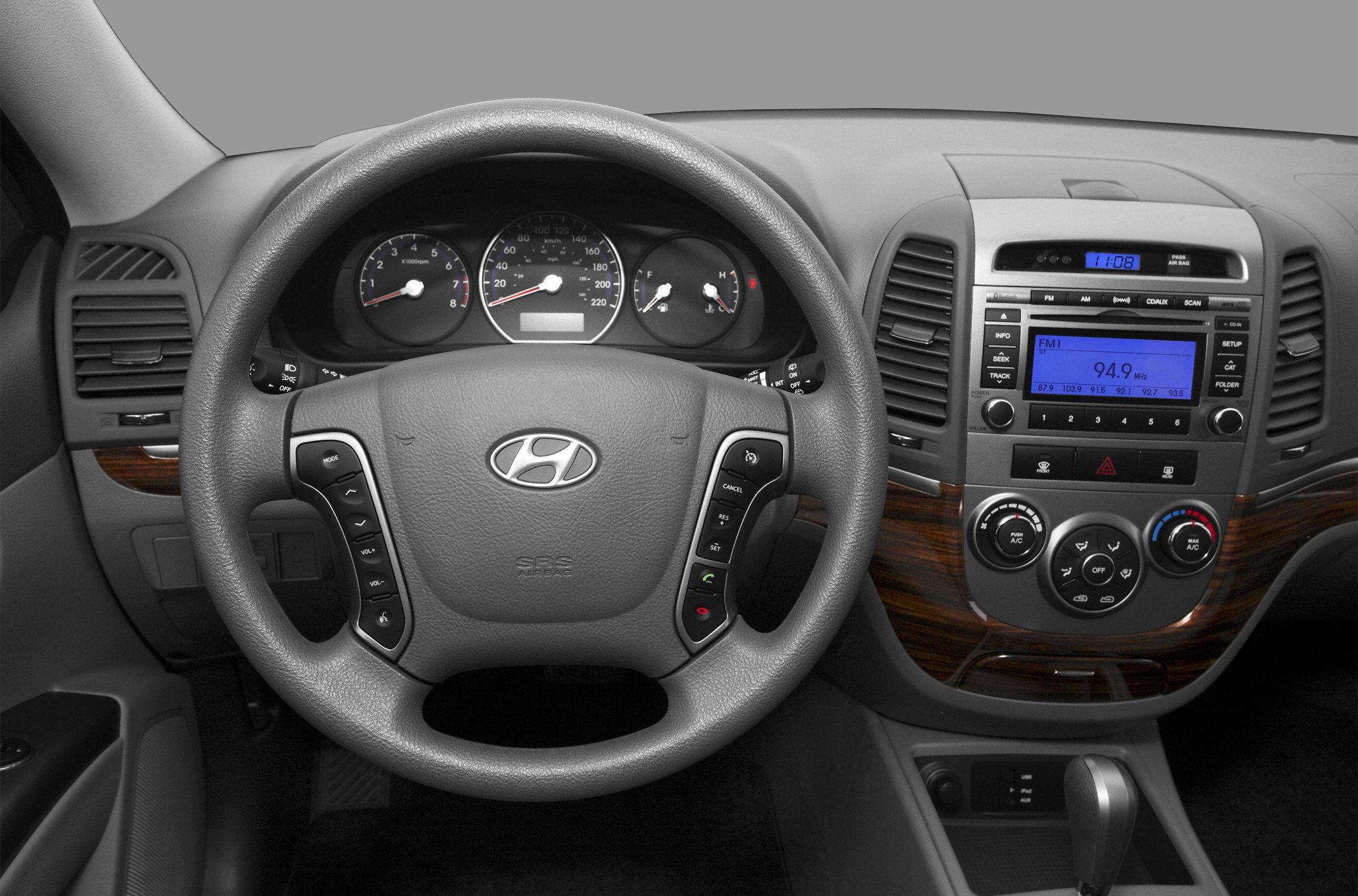Dashboard and steering wheel with audio and climate controls