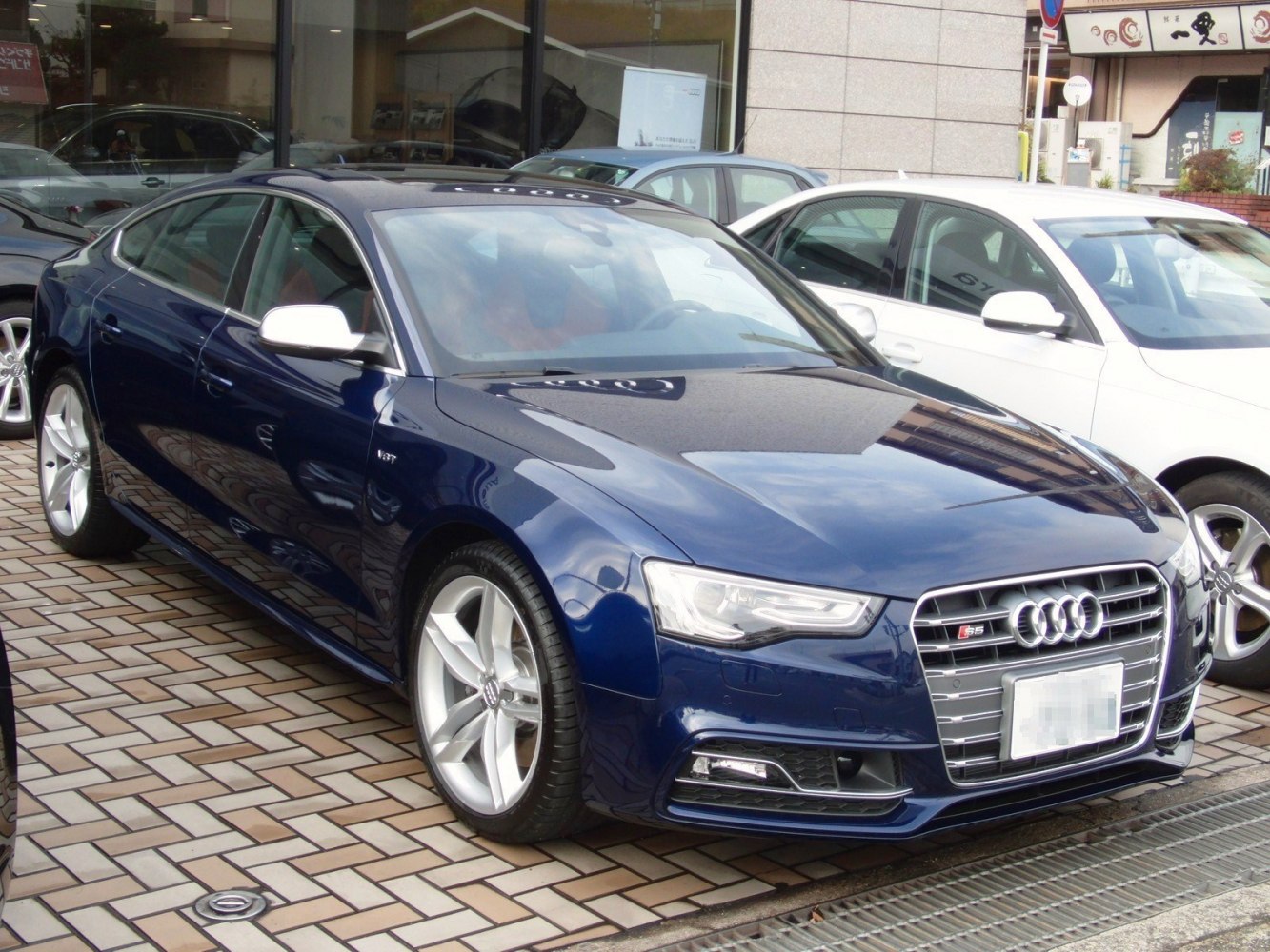 Front view with LED headlights and signature grille