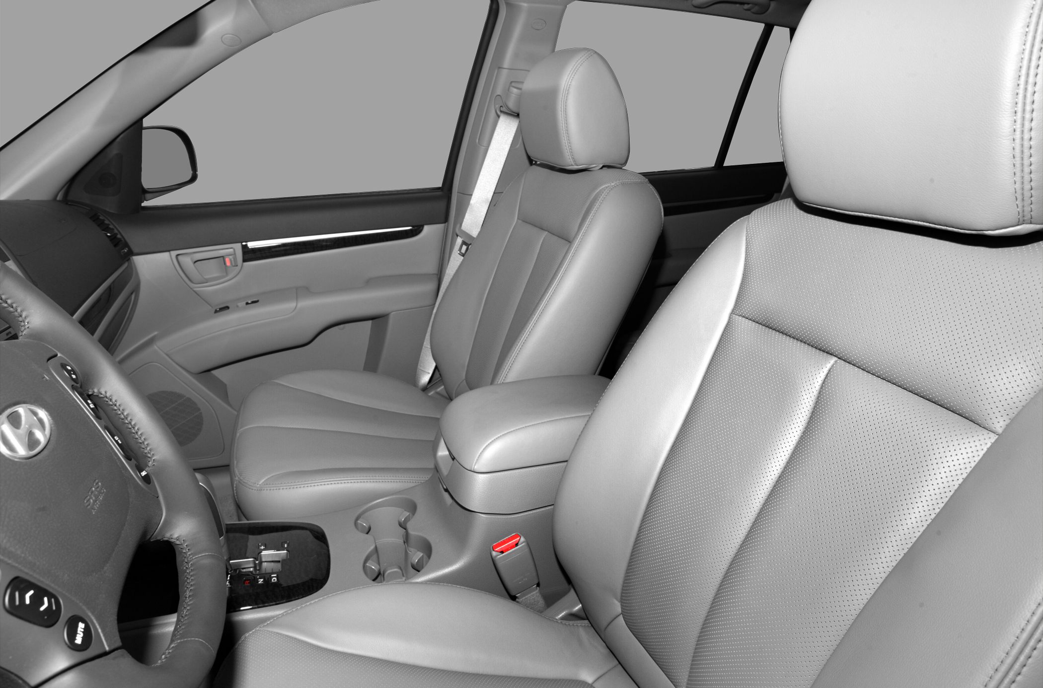 Leather seats and dashboard with steering wheel and cup holders