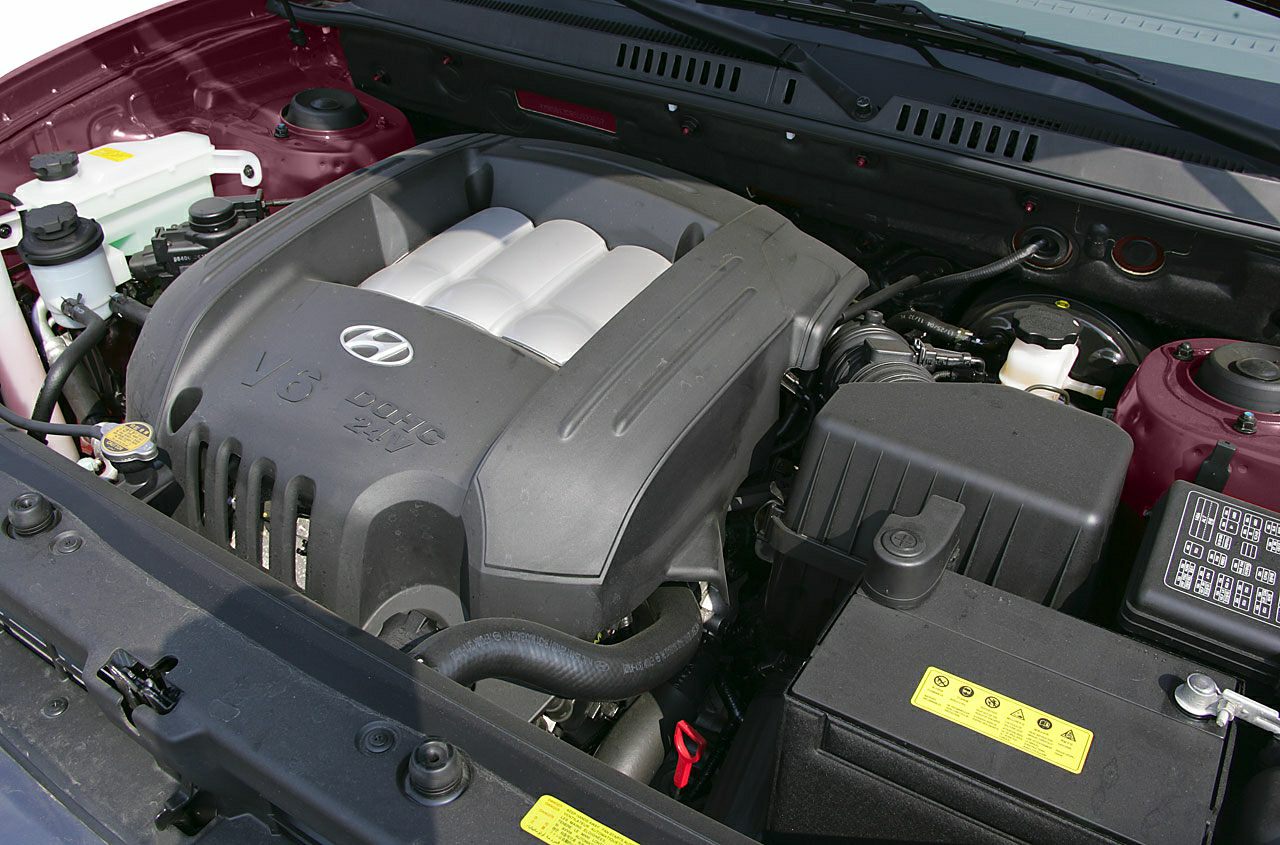 V6 DOHC 24V engine with cover and visible engine bay components