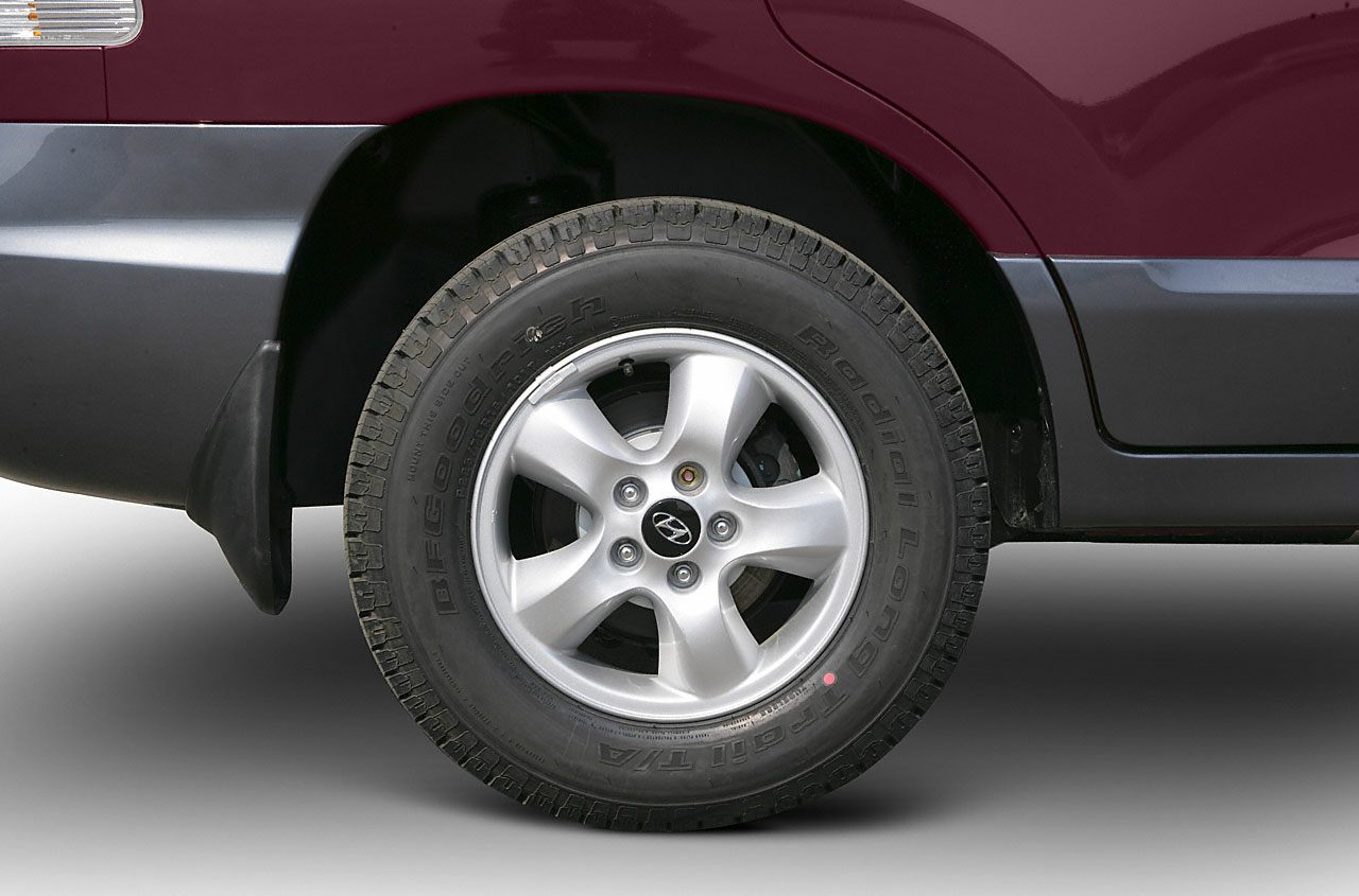 Alloy wheel and tire close-up with five-spoke rim