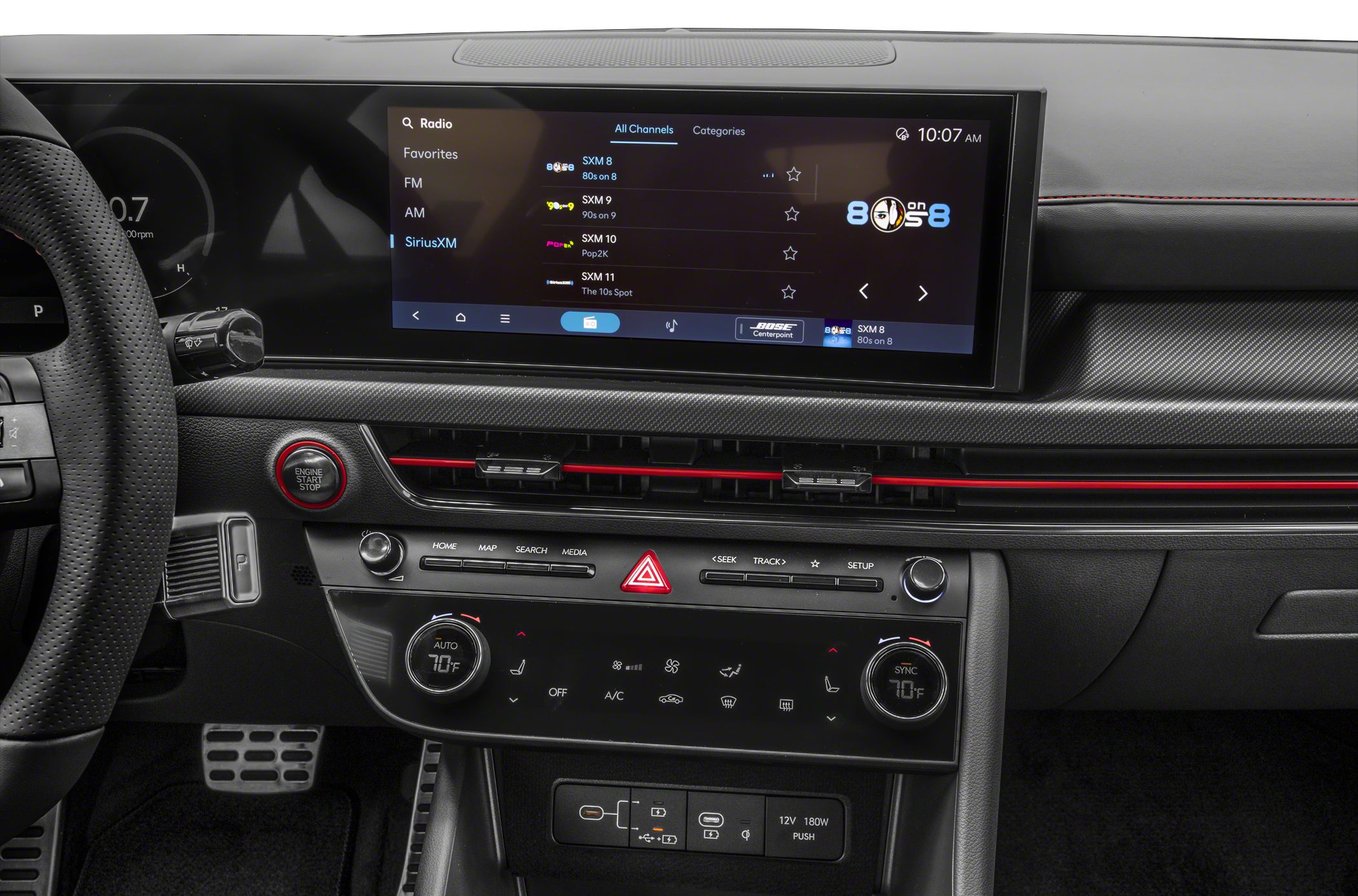 Widescreen infotainment and digital climate control panel with startup button