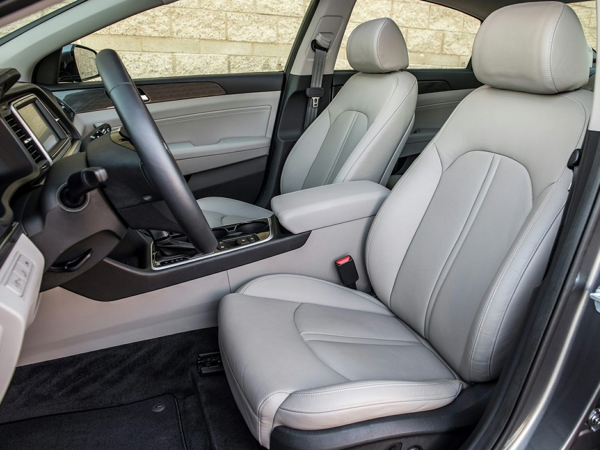 Beige leather front seats with modern car interior design