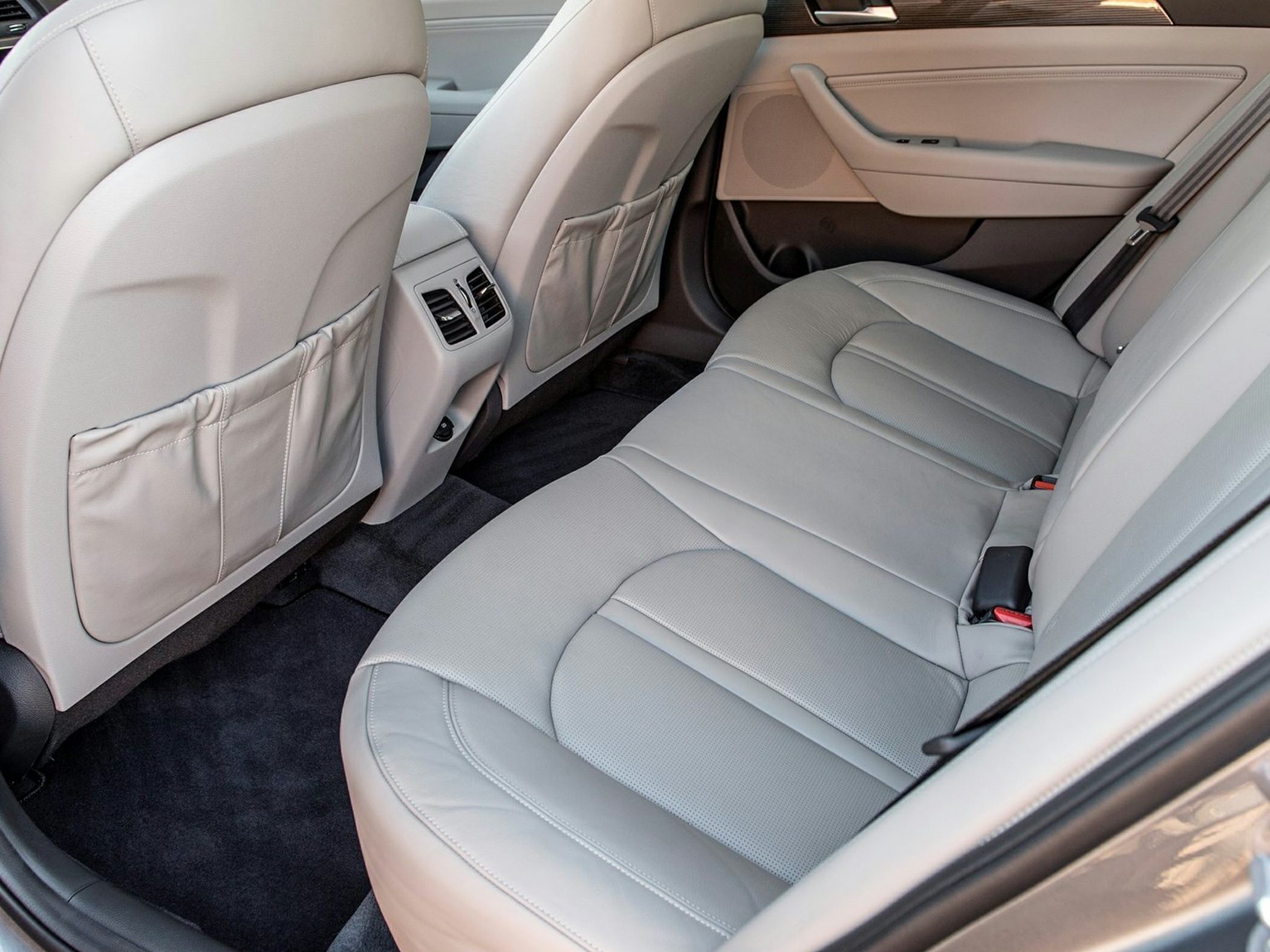 Rear seat with light leather upholstery and rear air vents
