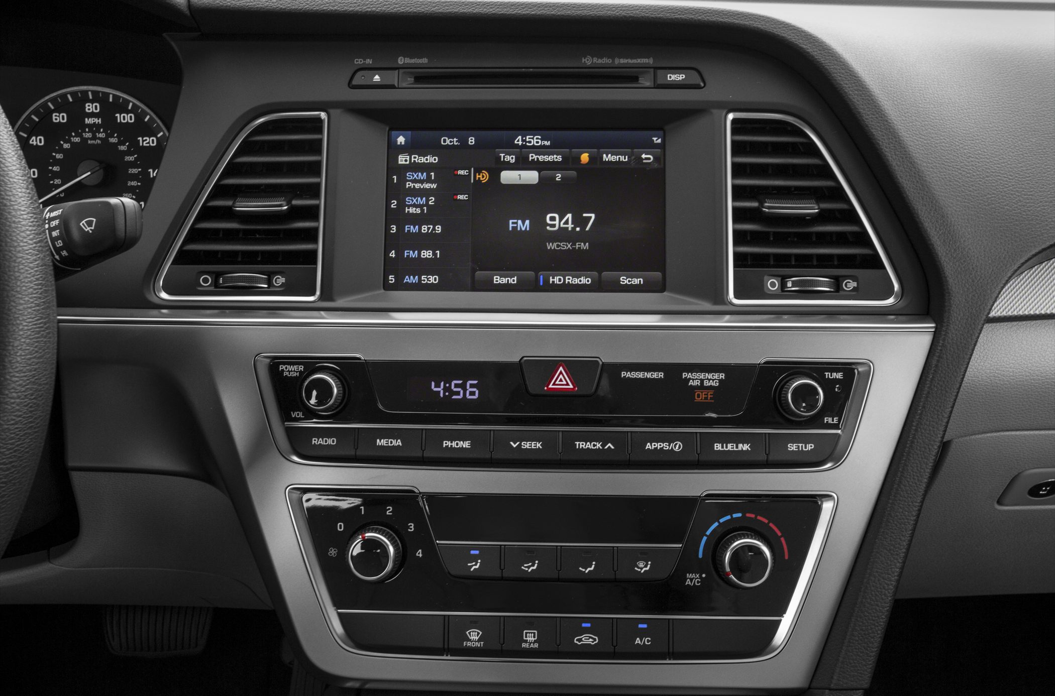 Dashboard with digital infotainment screen and climate control knobs