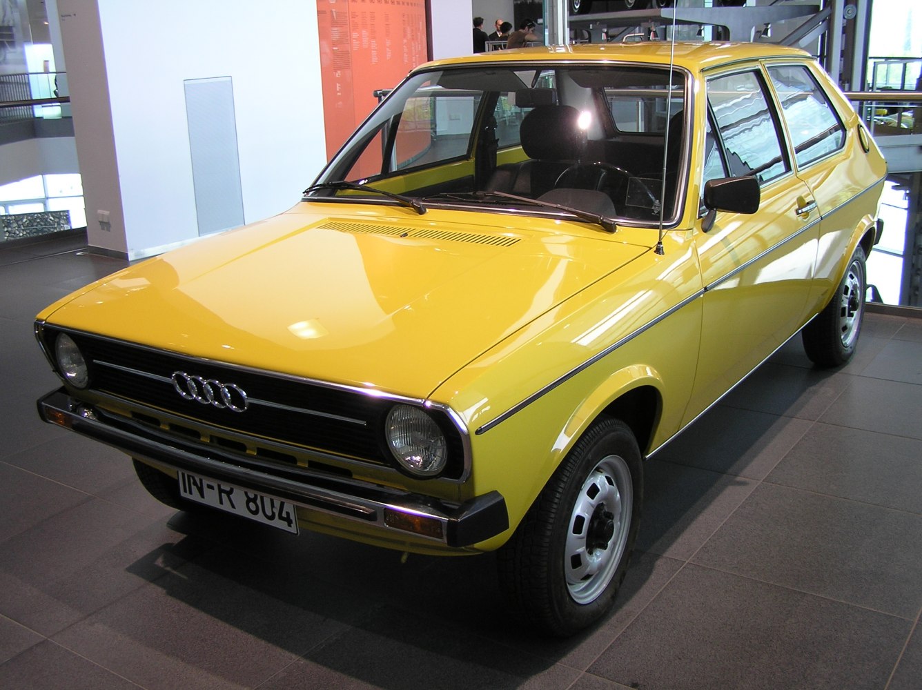 Classic compact hatchback with round headlights and retro front design