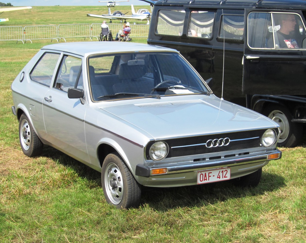 Classic compact hatchback with round headlights and distinctive grille.