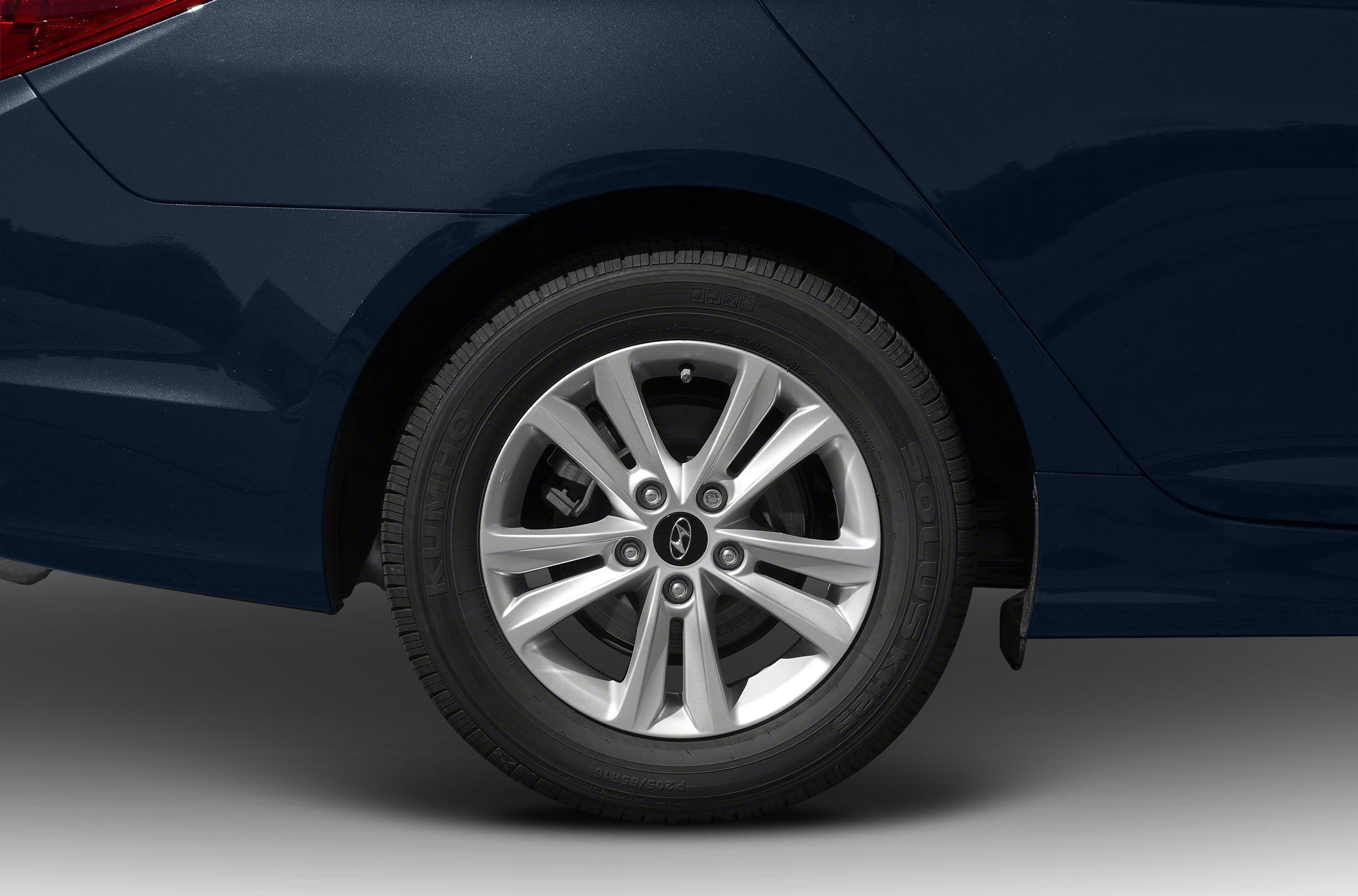 Rear wheel featuring a multi-spoke alloy rim and Kumho tire.