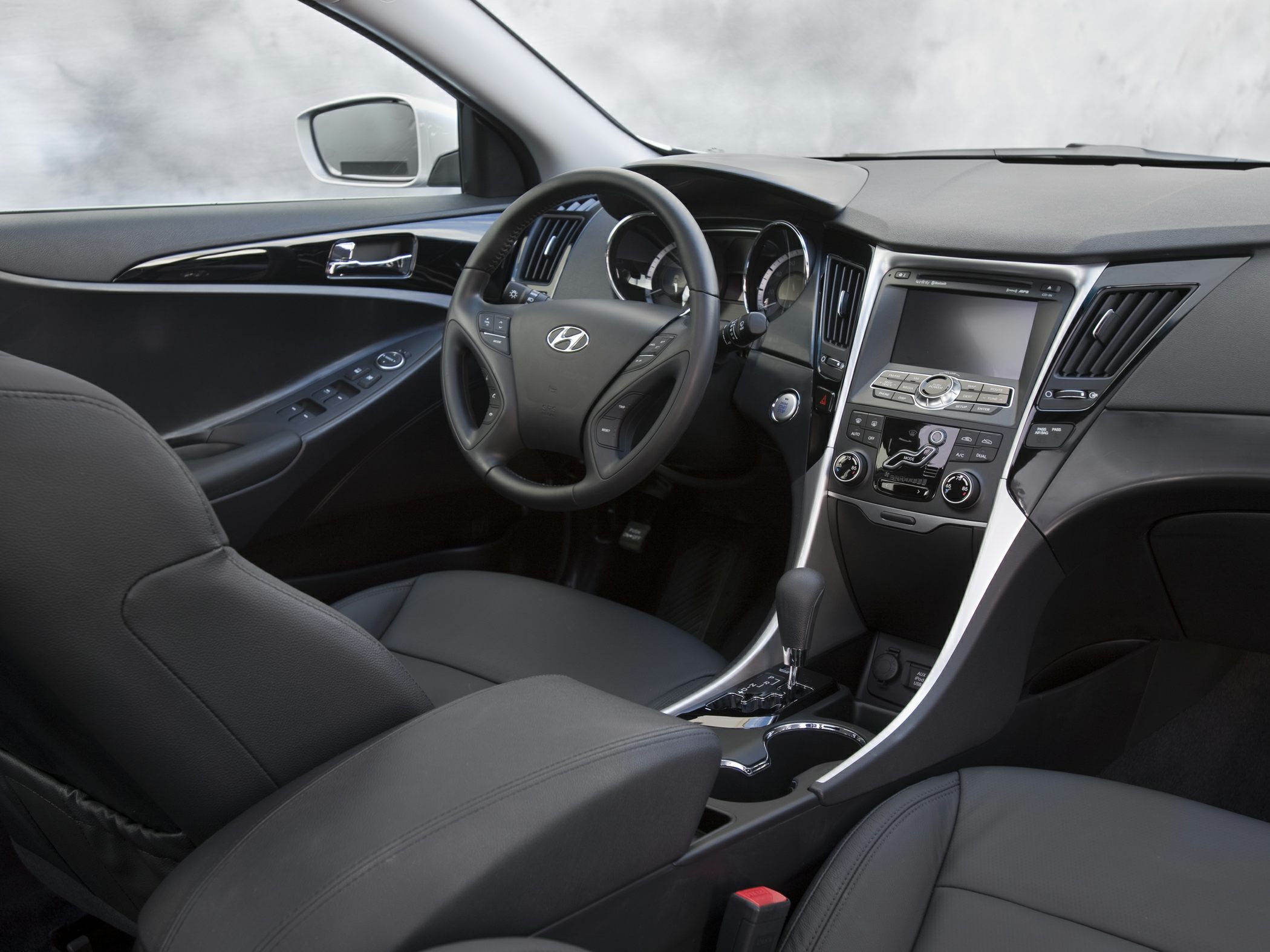 Modern car interior with dashboard and multifunction steering wheel