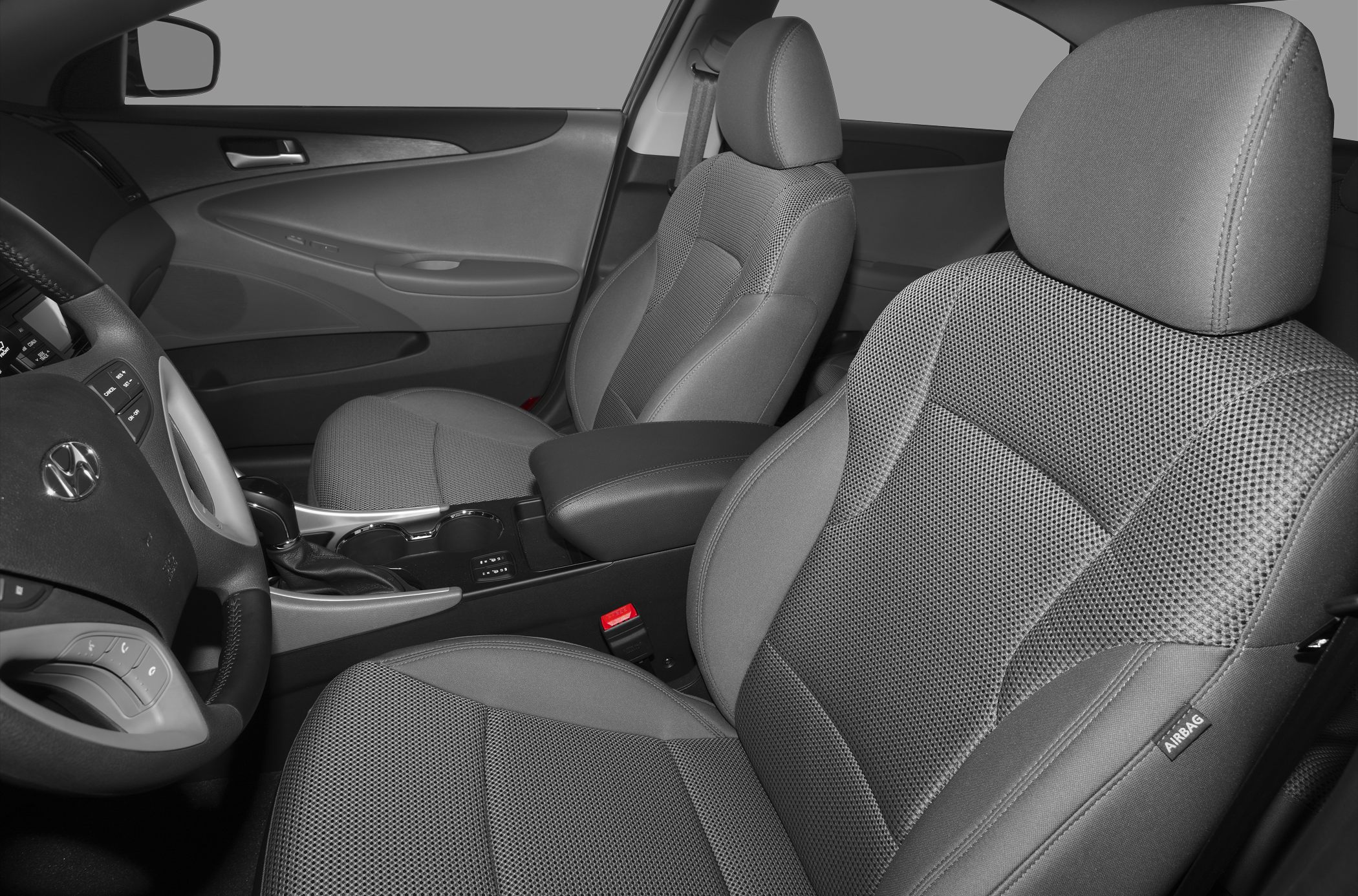 Front fabric seats, dashboard, and center console interior details