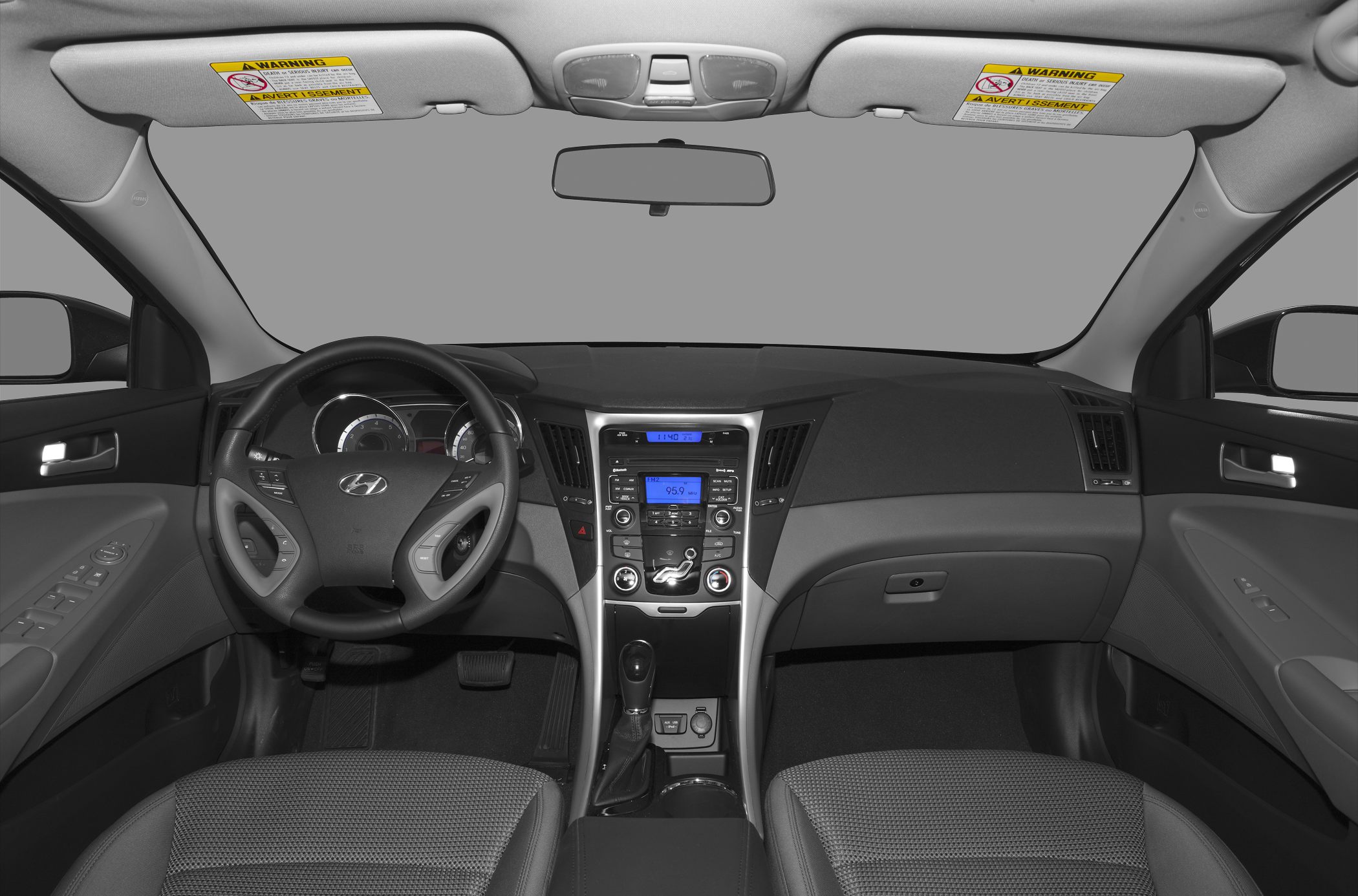 Interior dashboard and steering wheel with audio system and climate controls