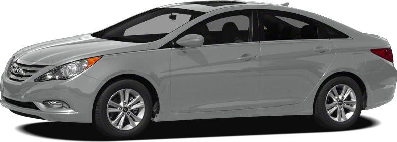 Side profile of a sedan with curved roofline and alloy wheels.