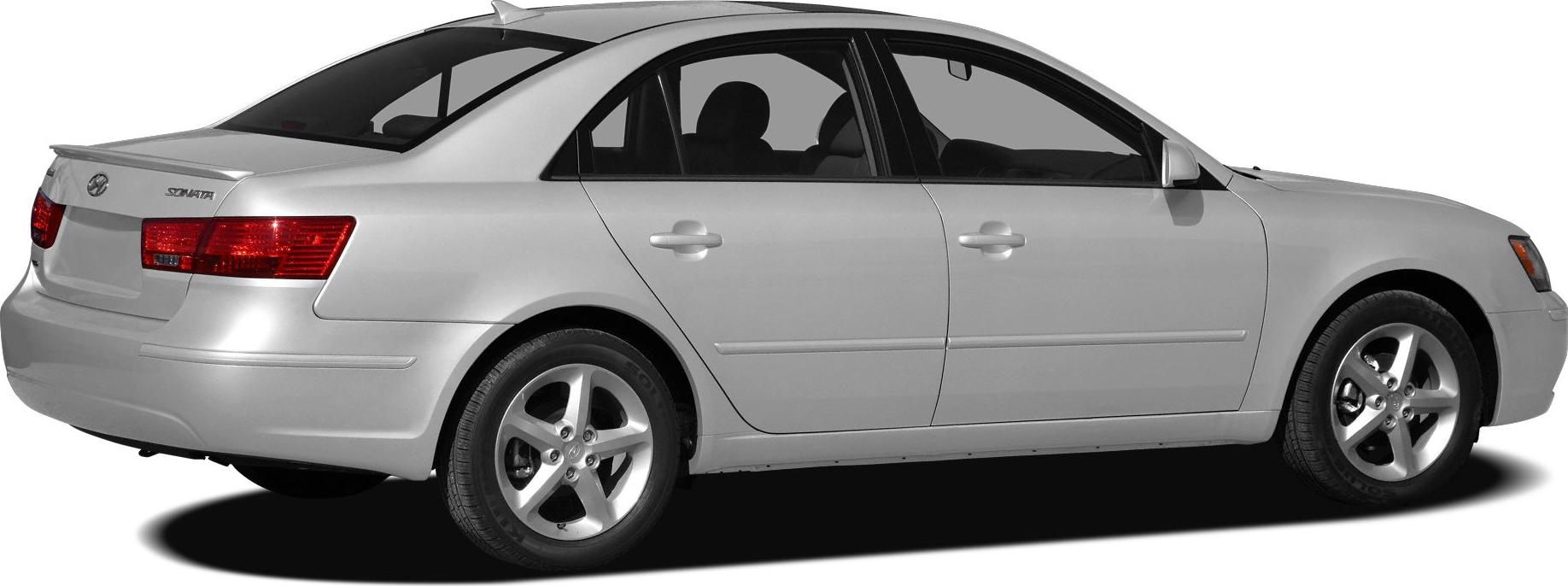 Silver midsize sedan side and rear view with alloy wheels and rear spoiler