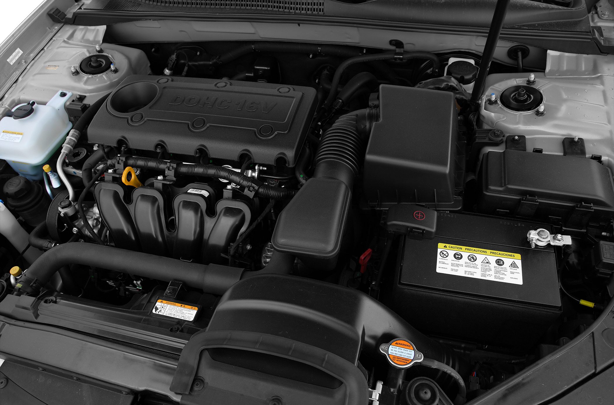 Close-up of DOHC 16V engine and battery in engine bay