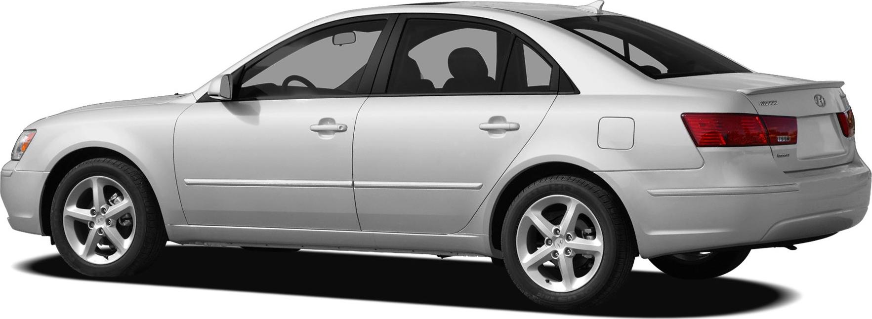 Silver four-door sedan side profile with alloy wheels