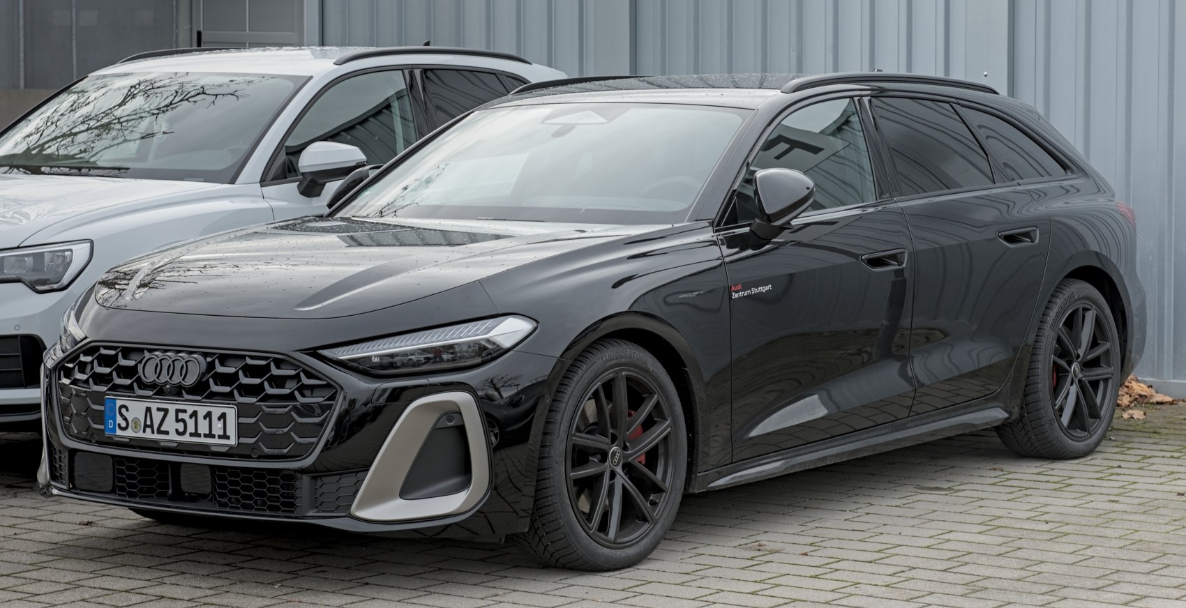 Black station wagon with aggressive grille and LED headlights