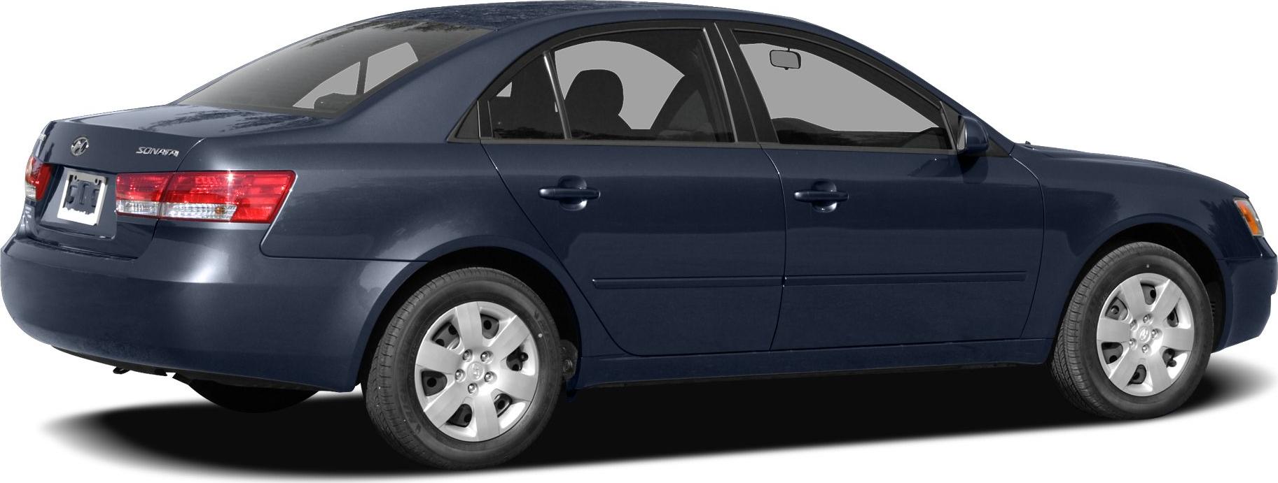 Side rear view of mid-2000s sedan with alloy wheels and distinct taillights