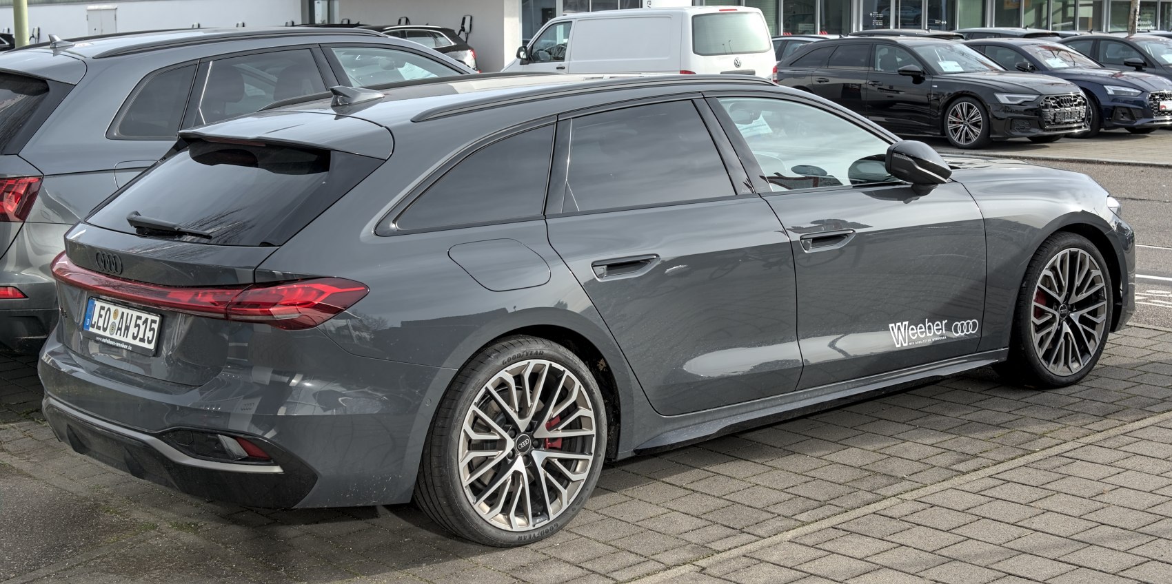 Rear-side view showcasing sleek rear light design and alloy wheels.
