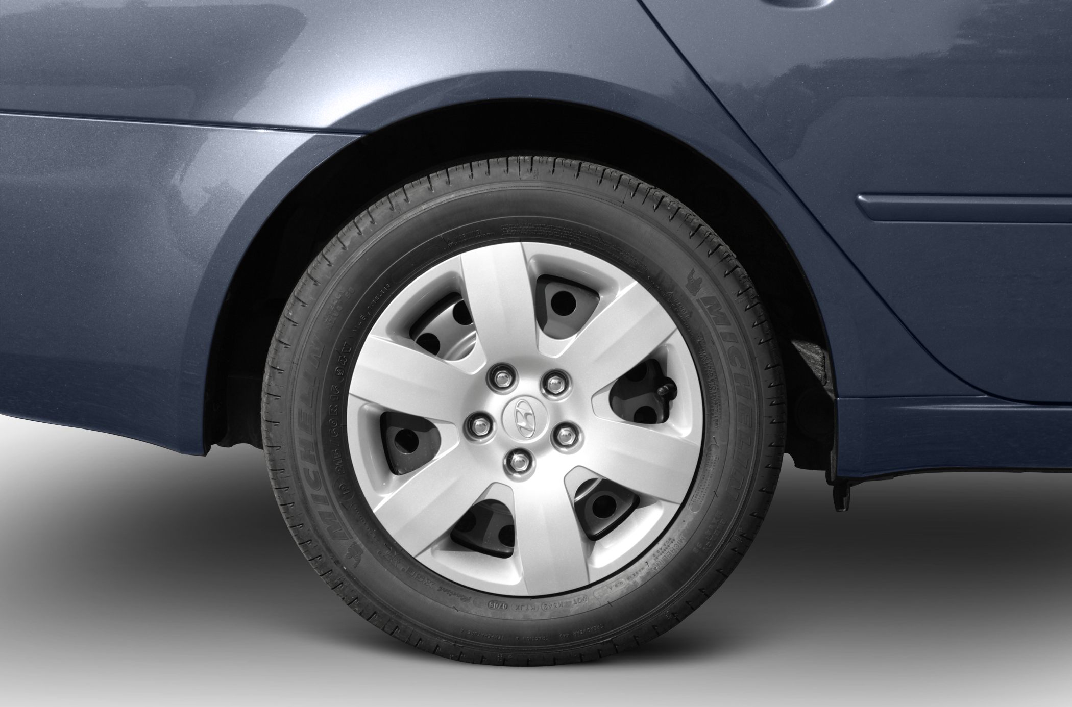Close-up of alloy wheel and tire on a car's rear wheel