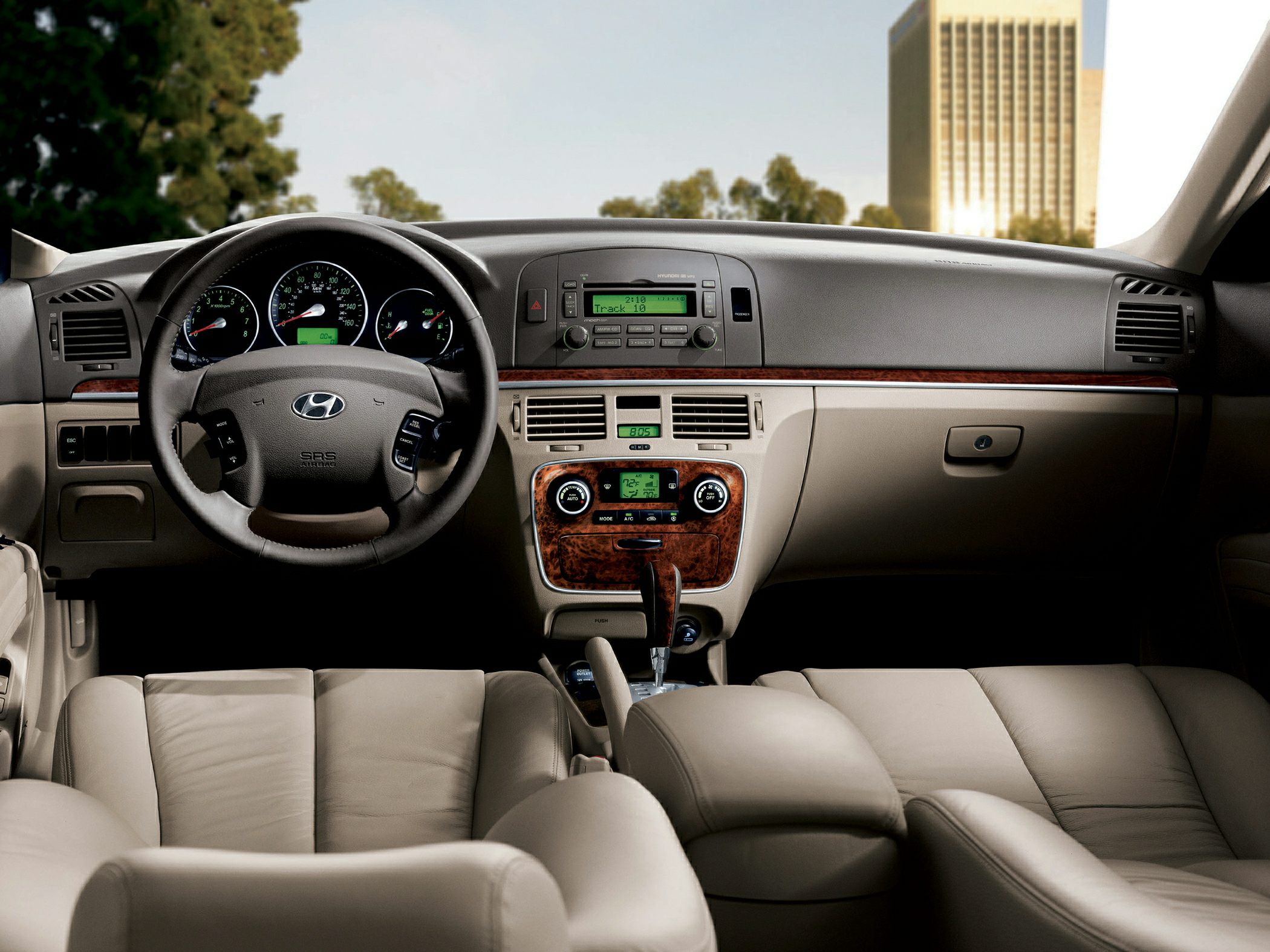 Dashboard and steering wheel with center console and wood trim accents