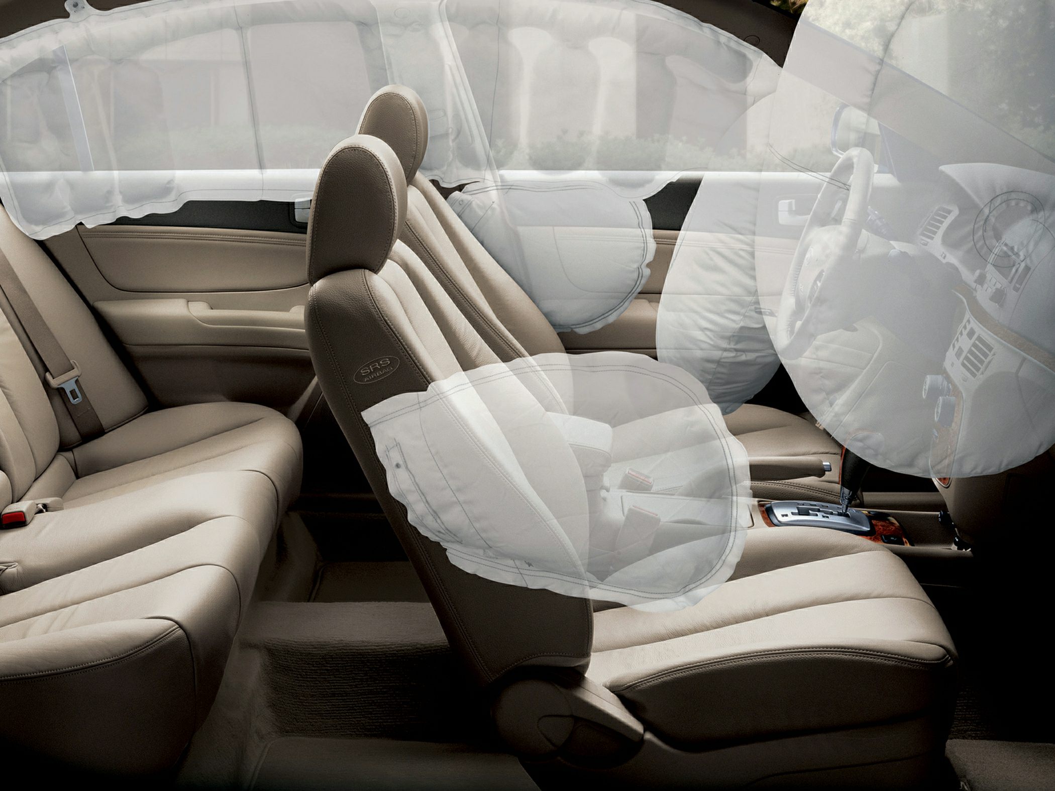 Interior with front, side, and curtain airbags deployed