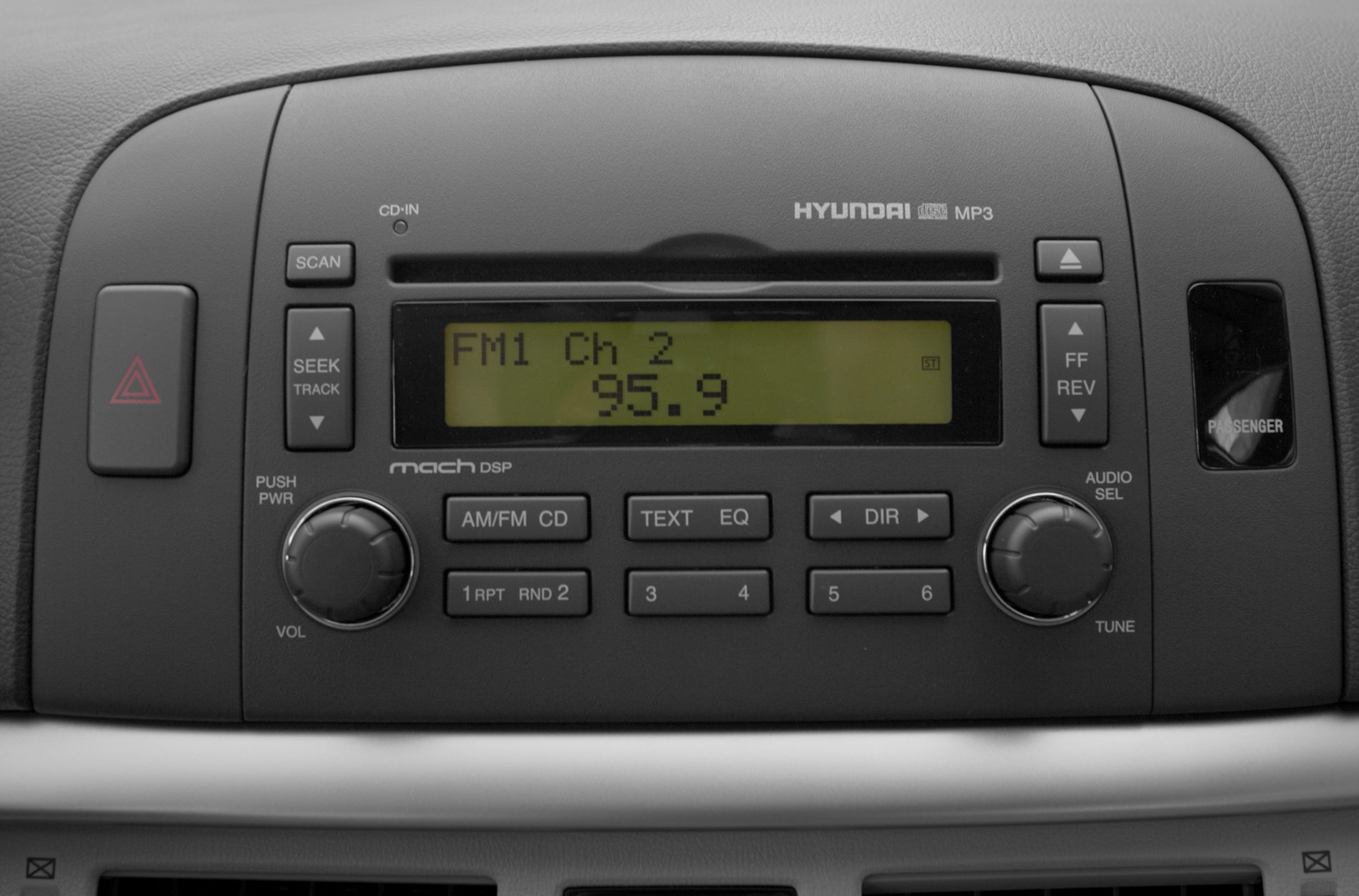 Car stereo system with CD player, FM radio, and MP3 display in dashboard