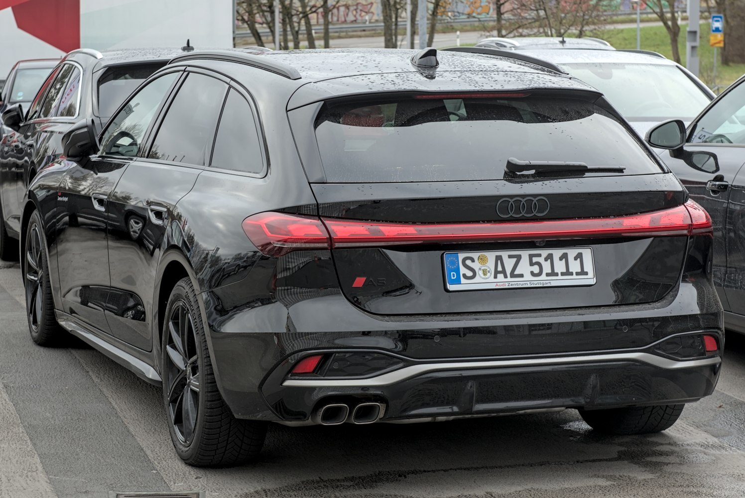 Rear view of station wagon with continuous LED tail light and quad exhaust tips