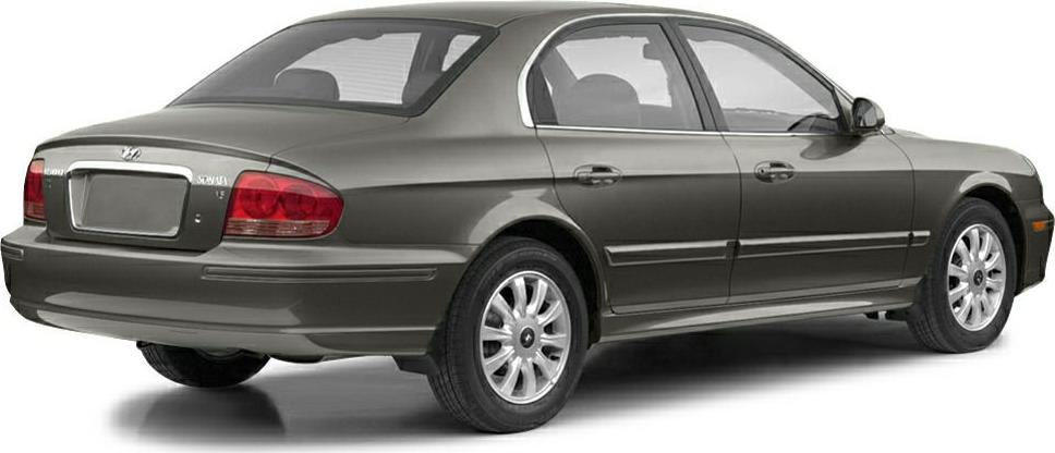 Rear and side view of mid-2000s four-door sedan with alloy wheels